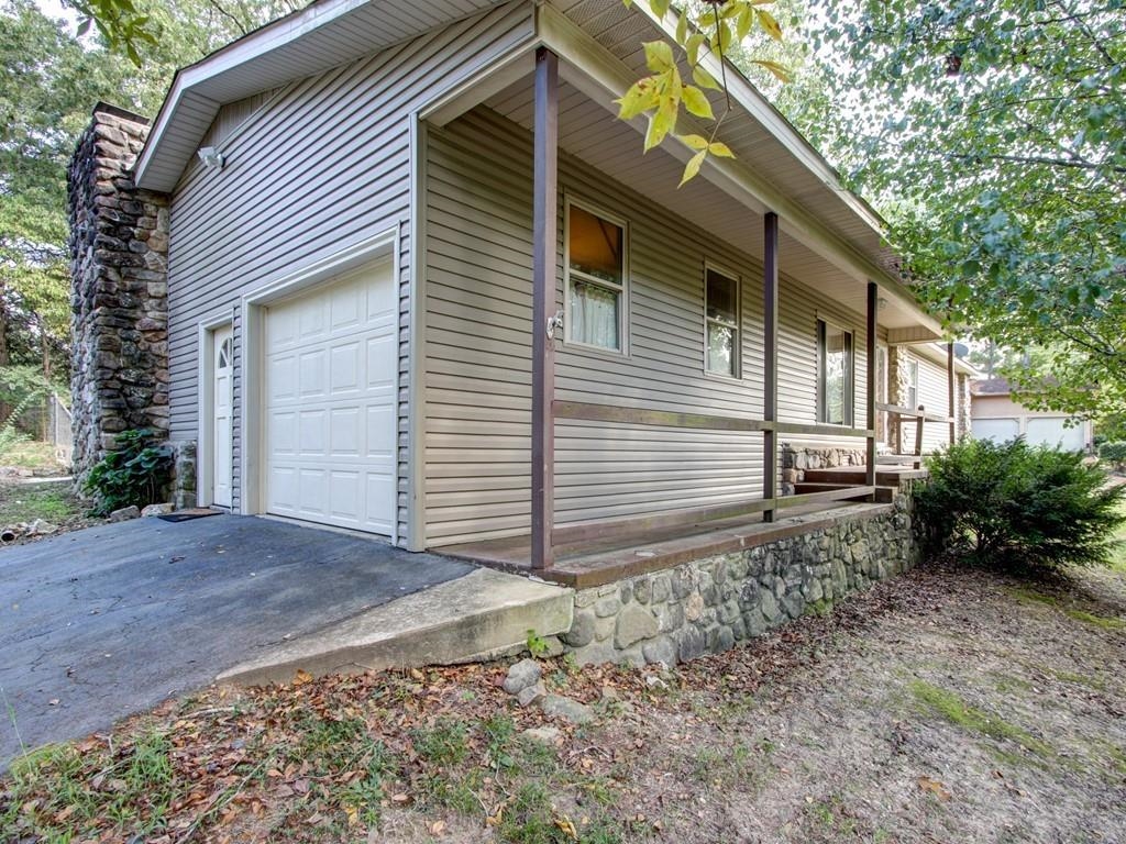 Little charmer in Lake Hamilton School District. Big corner lot with fenced in backyard, carport and one car garage. Fireplace in living area, master bedroom with attached bathroom.