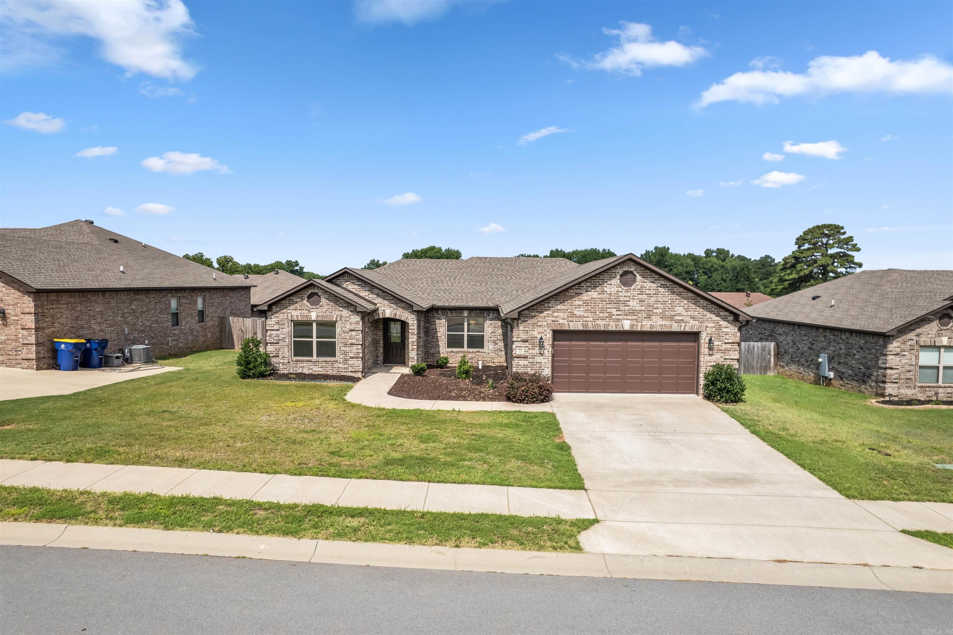 Location - Style - Quality - Shall I Go On?  If you are shopping in this price point you will want to see this home! Instant curb appeal from the time you arrive at the home even by the slight curve of the walkway you are already captured. Entering the home you immediately notice the wide-open concept, ideal for entertainment and great memories! From the accented exposed beams to the mantel to the decorative ambience of the electric fireplace perfectly complimented by the flooring!  Are you ready to make an Offer yet?  On your left is the guest bathroom and bedrooms (front and rear). On your right is the breakfast area/dining space, breakfast bar, kitchen, pantry/laundry space with entry/exit to the garage. Also off the kitchen is the Master Bed and Bath along with all the stunning accents above the shower and tub and more! Yes, they made this place special!  Now, let's step out back...The covered back patio is large, color matched and ready for great fun!  Do not miss out on this home...See Agent Remarks.