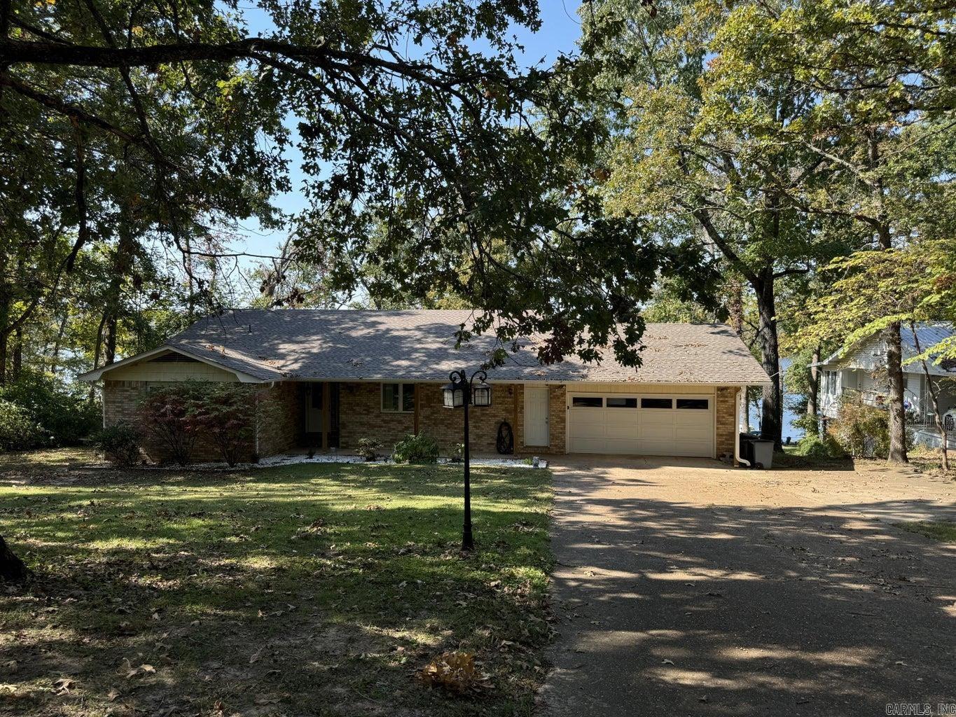 Currently a profitable AirBnB, this nicely updated Crown Lake front home features 3 Bedrooms and 2 Baths. Home features open floor plan with primary bedroom on opposite ends of home. Large kitchen opens onto covered porch with stunning lake views. Main floor living room features a gas fireplace. Walkout basement features game room and electrical closet. New roof and dock added in 2022. Make it your new lake home or your next investment property! The link to the AirBnB is https://www.vrbo.com/2589105