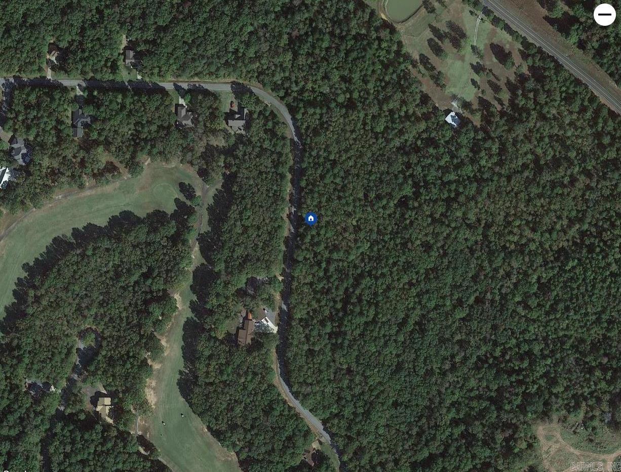 Nice level buildable lot across the street from Indian Hills Golf Course.   Back of these 2 replatted lots are wooded privately owned acreage.  A beautiful location for your home!!  And with plenty of space for the perfect placement of the house and driveway, yard.   Just minutes from the Indian Hills Golf  Pro Shop and Little Red Restaurant.  Houses across the street are on the golf course. Ask about Membership Dues/fees.