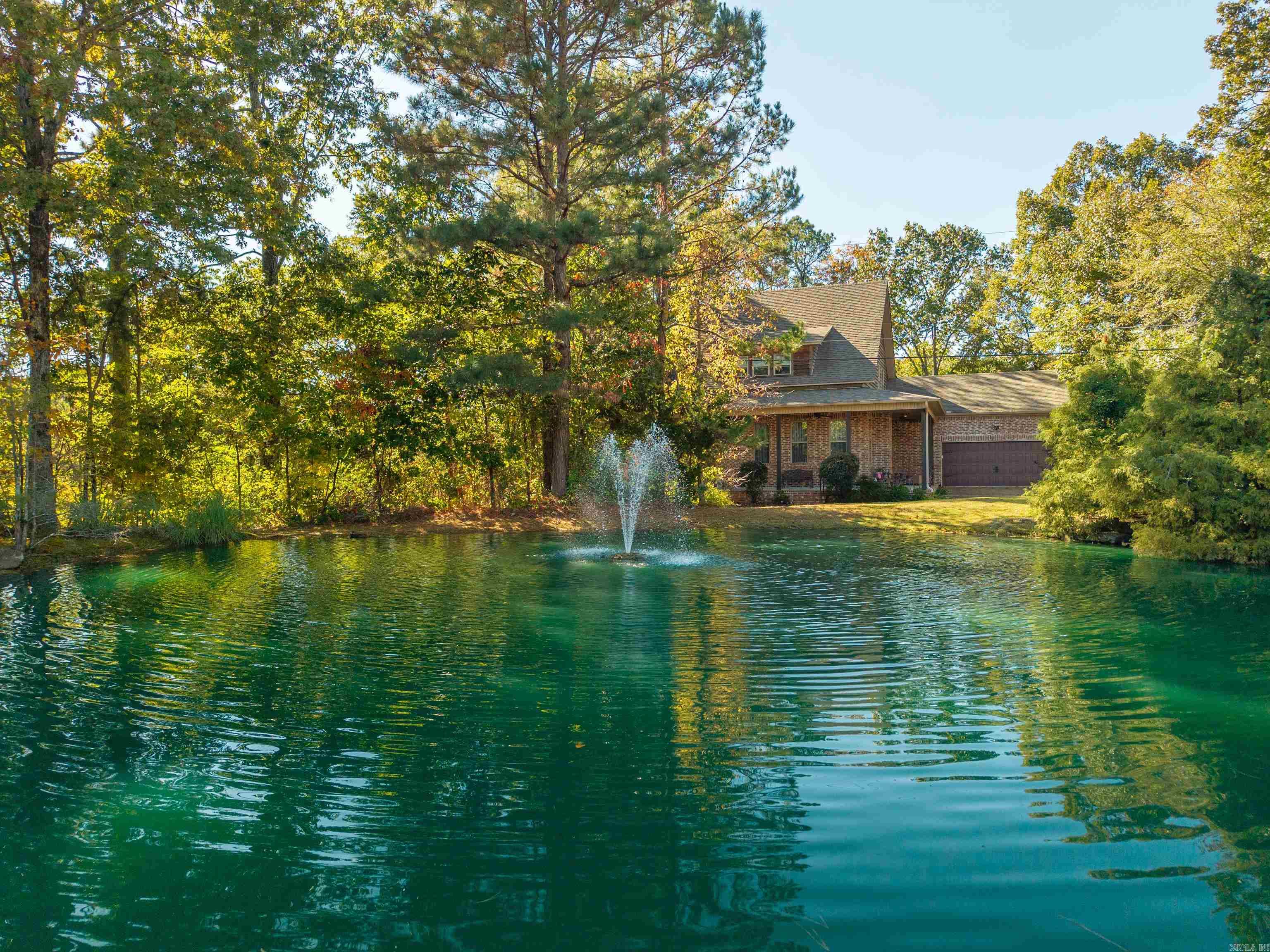 Welcome to Spencer Springs - which has been described as a peaceful boutique community.  It is a private. secluded, and gated community and yet it is conveniently located near Lakeside School and Lake Catherine.  This home features an open floor plan with high ceilings.  It is spacious with a large main suite and an ample walk in closet.  Relax on the covered patio and unwind with friends. This one is worth seeing before buying anything else.  POA covers gated entry, sprinkler system, grounds including your lawn, water features, and pond maintenance. New HVAC system installed Feb 2026 - Rudd.