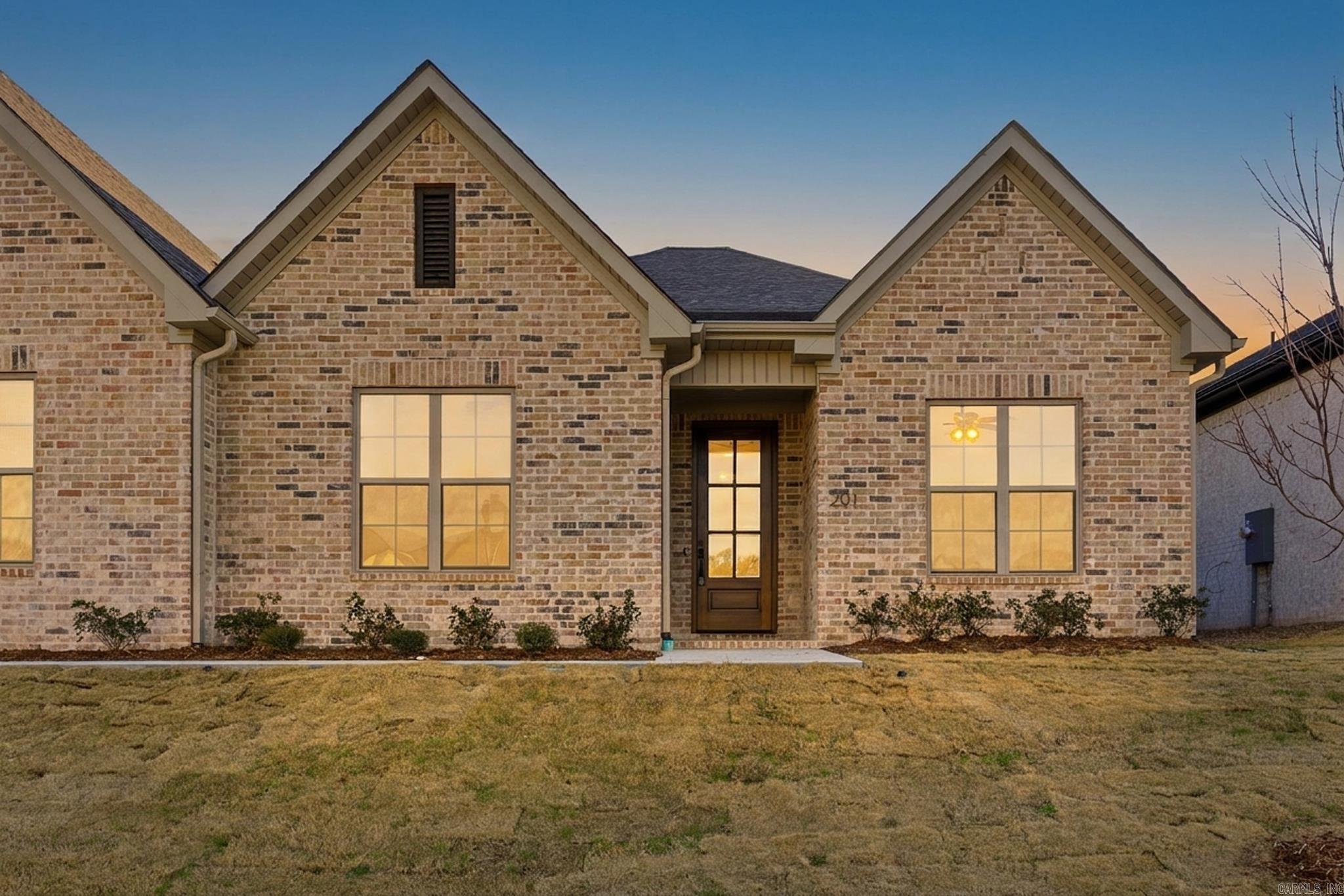 Surrounded by lush landscaping & mature trees, this community offers a private, tucked-away feel just minutes from premier shopping & dining. Never mow your lawn again! Lawn maintenance is included with yearly fees.  This stunning attached home features an open concept layout with thoughtfully curated designer finishes throughout. The chef’s kitchen showcases a large center island that flows seamlessly into a dining area that overlooks a spacious living area.   Each residence is separated by fire walls with sound cavities, creating a quiet, private environment designed for comfort. The back porch offers the perfect place to unwind or entertain while overlooking a back lawn.  Currently under construction with an anticipated completion and move-in timeline of mid-Sept. Buyers who go under contract within the next 30 days will have the opportunity to participate in the interior selection process, allowing for a more personalized, design-forward finish. Photos are of a similar floor plan & are for reference only. Finishes may vary.