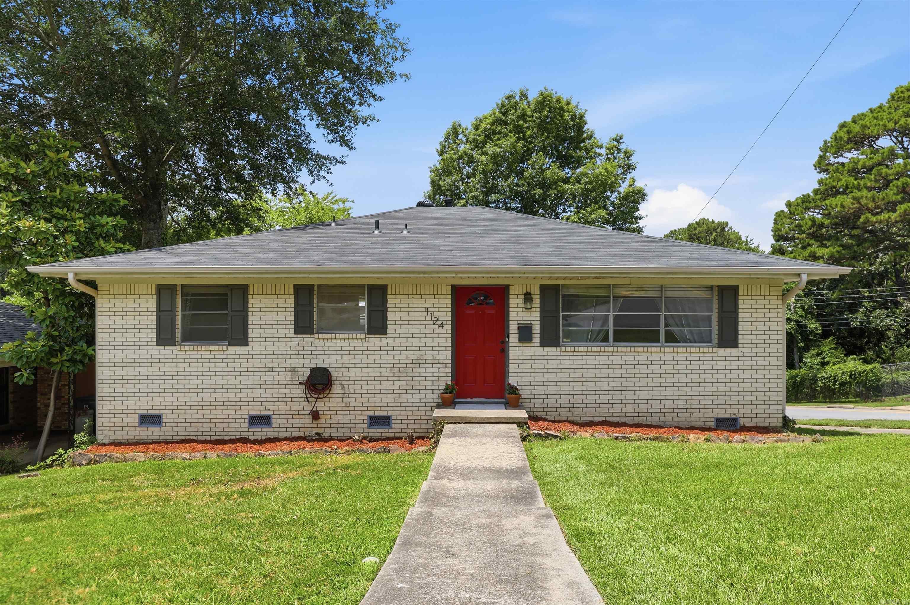 Welcome to Mellon Street! Located in the incredibly convenient Success Subdivision in Midtown, this single-story home boasts numerous updates! These include a new roof, new deck (2024), kitchen updates (2021), 2023 hot water heater, 2020 HVAC, added insulation, built-ins, new vapor barrier, and updated paint throughout. This home welcomes you into the first living area, filled with natural light, and the privacy blinds will remain. The updated kitchen features a large island and opens to a generous dining area. From the kitchen, French doors lead to a secondary living space complete with a dry bar and built-in desk. The home offers two bedrooms, including a primary suite with its own en-suite bathroom. The third room provides flexibility and could be used as a bedroom, office, bonus room, or game room. The spacious backyard is private and fully enclosed by a wooden privacy fence. The home also features a large crawl space, accessible through the carport, providing additional storage. Washer, dryer, and refrigerator to stay! Conveniently located near shopping, dining, parks, and schools, this move-in ready home offers flexible living spaces, major updates and exceptional value.