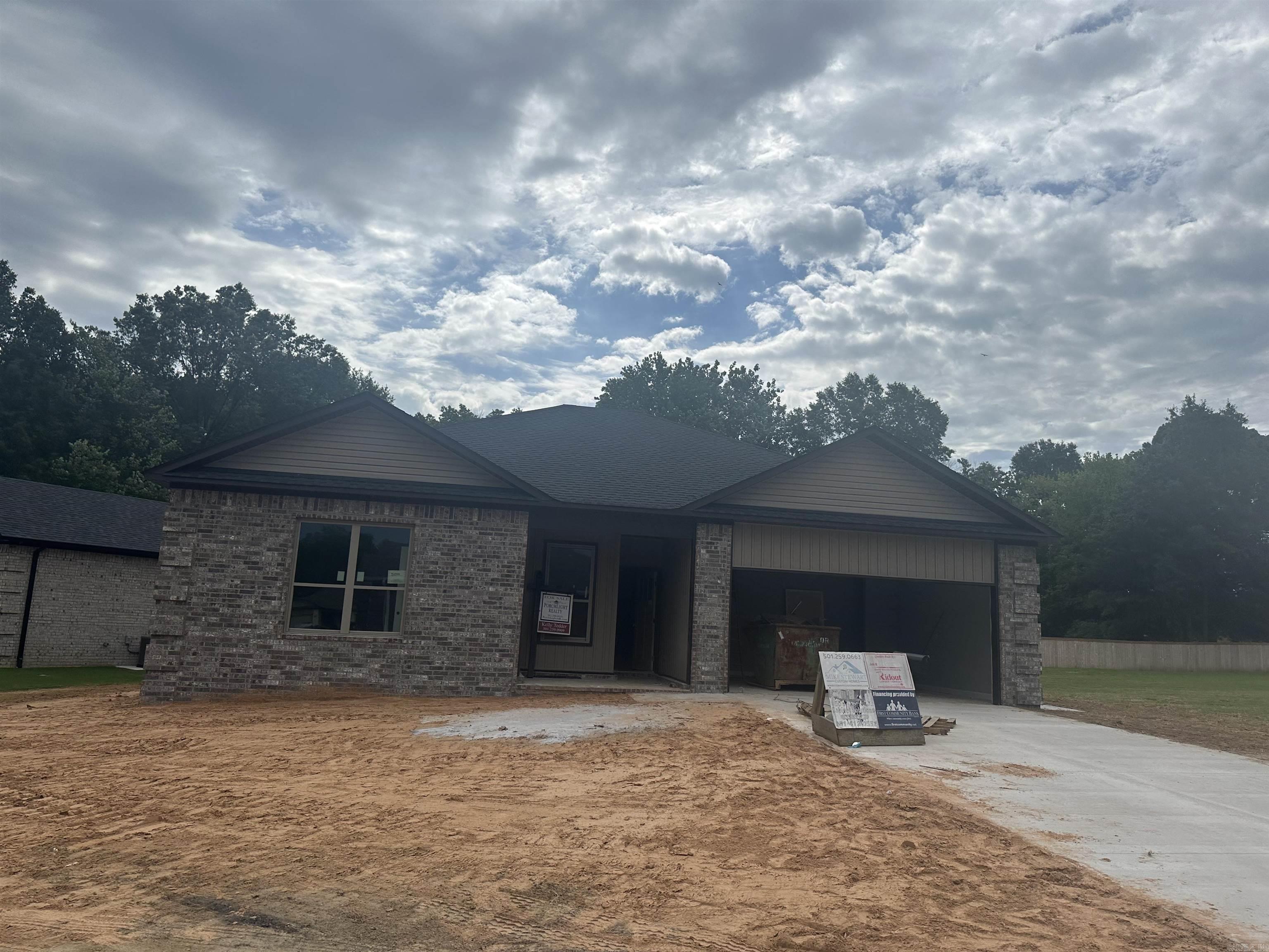 Beautiful new construction home close to shopping and restaurants.  This fabulous home showcases a thoughtful design with three bedrooms and two full baths, featuring a split floor plan for optimal comfort and privacy.  The home has cathedral ceiling with wood beams in living room, 9ft ceilings throughout, custom cabinetry with soft-close doors and drawers. The kitchen is a masterpiece with granite countertops,  tiled backsplash and a walk in pantry.  NO CARPET, luxury vinyl throughout the entire home.   Covered patio, two car oversized  garage and attic storage. Beautiful large walk in tiled shower in master bathroom and double sinks. This home backs up to a wooded area for added privacy. The seller will also added gutters.  This neighborhood is gated. Yard maintenance is included in the monthly POA dues.   Please contact listing agent for more details or for a private showing.   Please call today for additional information.