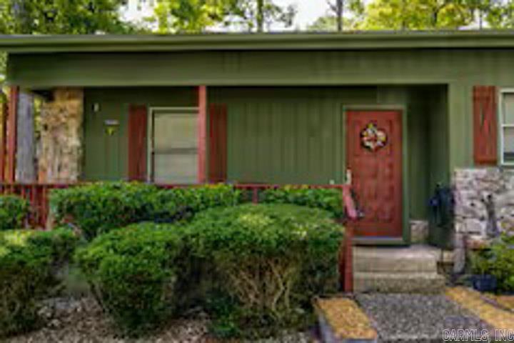 Hot Springs Village is a Playground for adults. Step into this beautifully furnished 2-bedroom, 2-bath townhome featuring a dedicated office and full laundry room for ultimate convenience. Thoughtfully stocked with fresh towels, quality linens, and all essential kitchen necessities, internet, POA dues, including water and sewer fees, are included. this home is ready for effortless living from day one.  Located on the desirable west side of Hot Springs Village, 30 Orantes offers quick access to the Coronado Fitness Center, located on lake Coronado, the Library, and Tennis Center. The primary suite includes an en-suite bathroom and spacious walk-in closets for added comfort.  Enjoy peaceful mornings on the private back patio, complete with a charming table and chairs — the perfect spot for your first cup of coffee as you take in the quiet beauty of the Village.