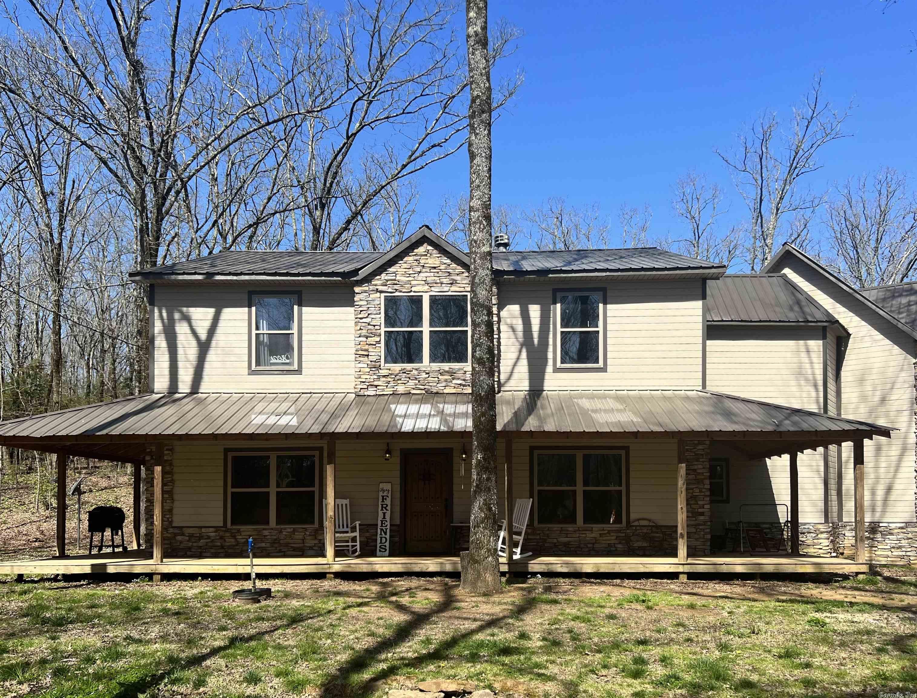 You'll find peace and tranquility in this "get away from it all" setting.  Spacious custom family home with traditional and classic rustic touches throughout make this the perfect respite from city life.  The open kitchen includes select granite counter tops and tile backsplash.   The range has been stubbed out for a chef's pot filler.  Tile and concrete showers in the baths add a special extra in this exquisite home.  A natural creek runs across the frontage of 9 acres of 4 wheeling fun.  Wrap around porch for after dinner rocking chair time or an ideal gathering place for family reunions.   A fenced barn area may inspire you to raise bottle calves or house a shetland pony.  If country living is calling you don't want miss this one.
