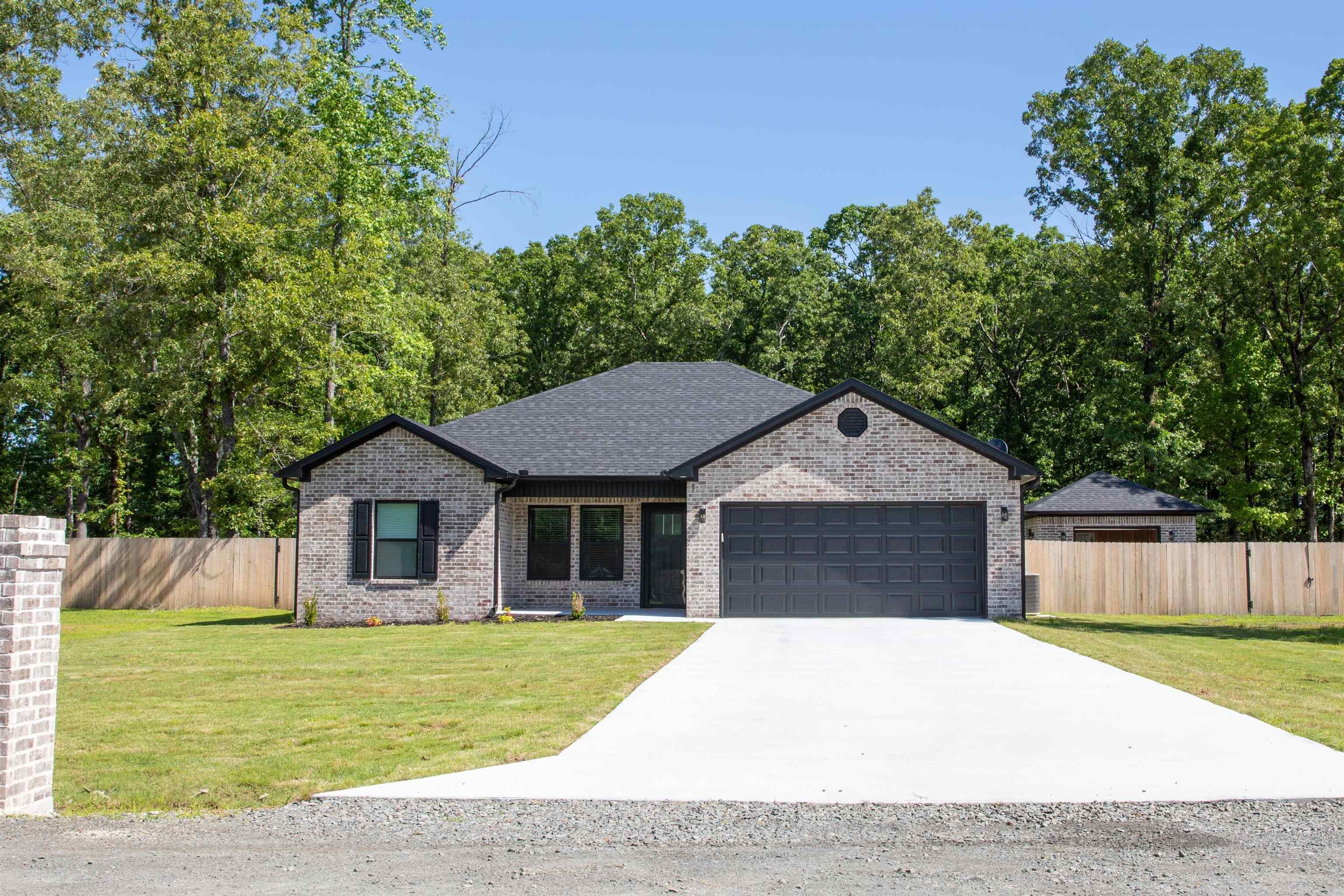 Welcome to peaceful country-style living with modern upgrades throughout! Situated on a beautiful 1-acre lot, this property offers the perfect blend of comfort, efficiency, and functionality both inside and out. Step inside to find a well-appointed kitchen featuring Whirlpool stainless steel appliances, soft-close cabinetry, and stylish finishes designed for everyday convenience. Energy-efficient spray foam insulation helps keep utility costs low year-round, making this home as practical as it is comfortable. Outside, you’ll love the fully fenced backyard and covered patio! Need extra workspace or storage? The 14x18 shop is a standout feature — complete with electricity and designed to match the home perfectly for a cohesive look. Additional upgrades include Anderson storm doors, gutters all around the house and shop, and quality exterior features that add both charm and durability. If you’ve been searching for space, efficiency, and move-in-ready convenience, this home is a must-see!
