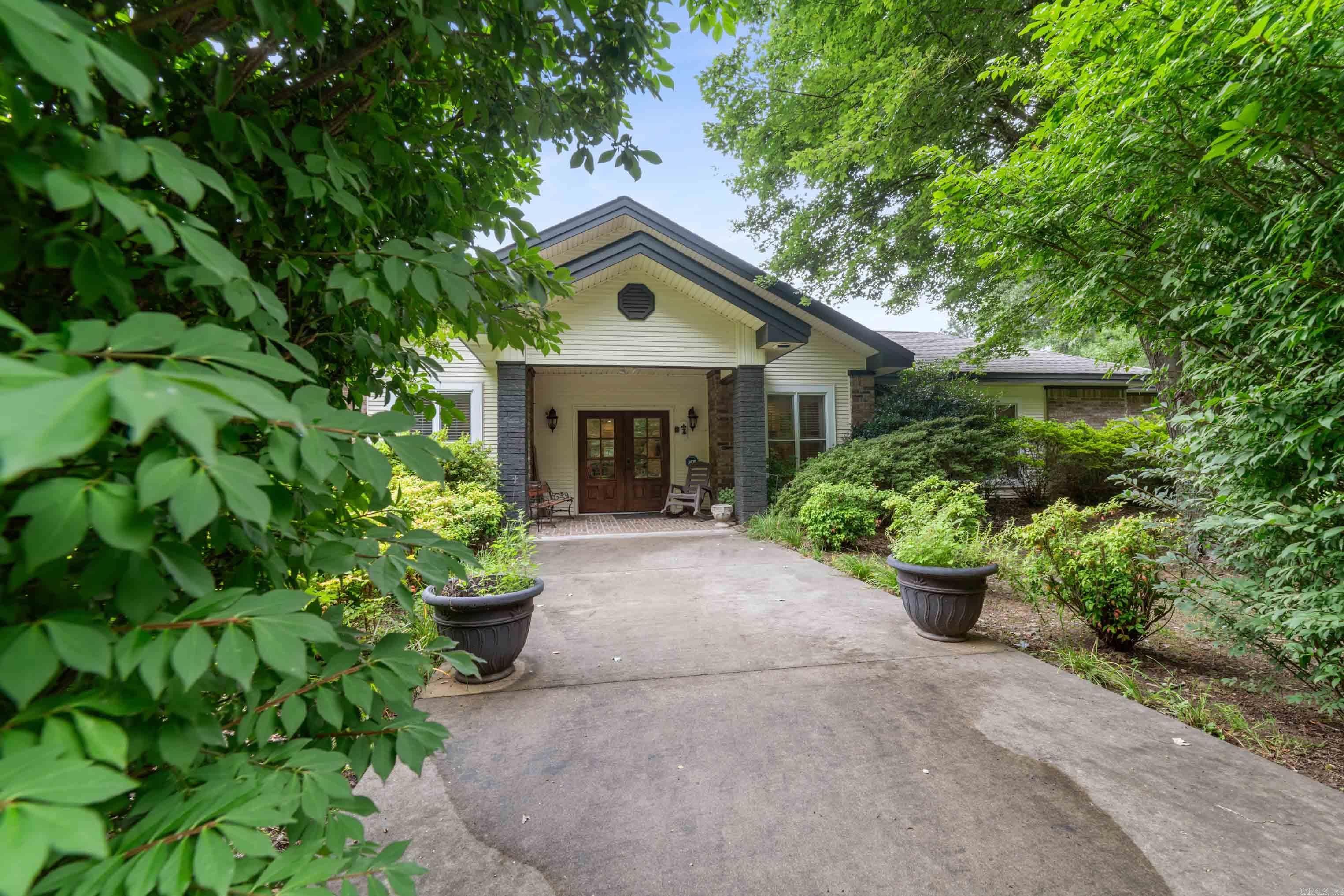 Welcome to an entertainer's dream nestled on 4.59 acres close to Little Red River. This exceptional home offers 2,600 sf of inviting open-concept living, centered around a stunning oversized rock fireplace that creates the perfect gathering space. Guests are welcomed by a circular driveway & impressive rock entrance. An expansive covered patio featuring a 2nd wood-burning rock fireplace, making outdoor entertaining enjoyable year-round. What truly sets this property apart is the attached 1,763 sf commercial kitchen and apartment. Currently under construction, this professionally designed space features top-of-the-line commercial kitchen equipment & was originally envisioned as a gourmet restaurant. Whether you're dreaming of a catering business, event venue, private chef's kitchen, or another entrepreneurial venture, the possibilities are endless. The attached apartment provides accommodations for guests, staff, or extended family. With abundant space, exceptional amenities, & limitless potential for both personal & business use, this one-of-a-kind property is ready to bring your vision to life.