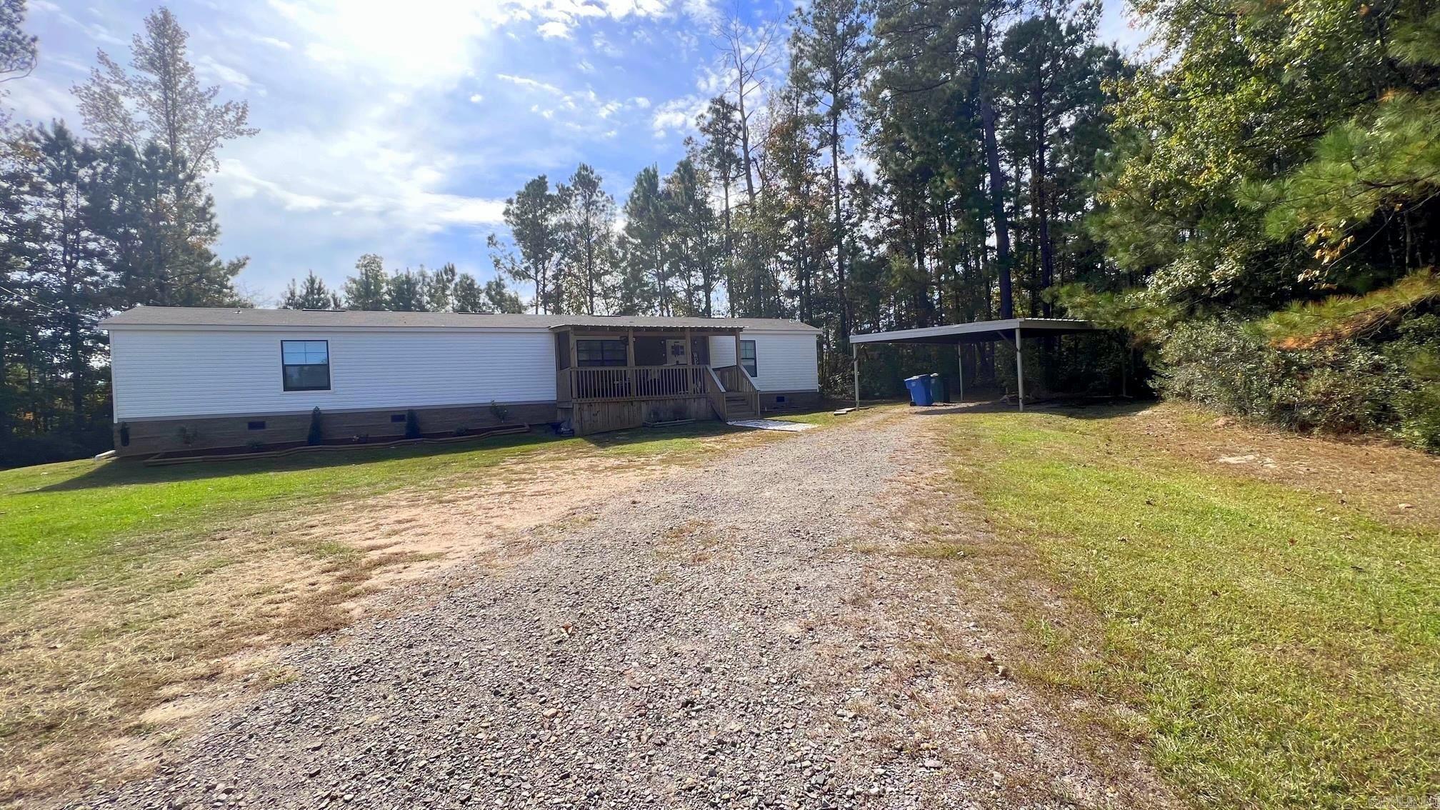 THIS 2021 SINGLE WIDE MOBILE HOME IS BEAUTIFUL AND SPACIOUS WITH OPEN LIVING DINING AND KITCHEN SPLIT FLOOR PLAN LVP FLOORING THROUGHOUT COVERED FRONT AND BACK PORCHES DETACHED 2 CAR CARPORT SEPTIC SYSTEM (AND THERE ARE 2 ADDITIONAL SYSTEMS ON LAND) ALL ELECTRIC VILLAGE WATER 2.72 AC  NOTE: FINANCING OPTIONS ARE DETERMINED BY BUYERS LENDER