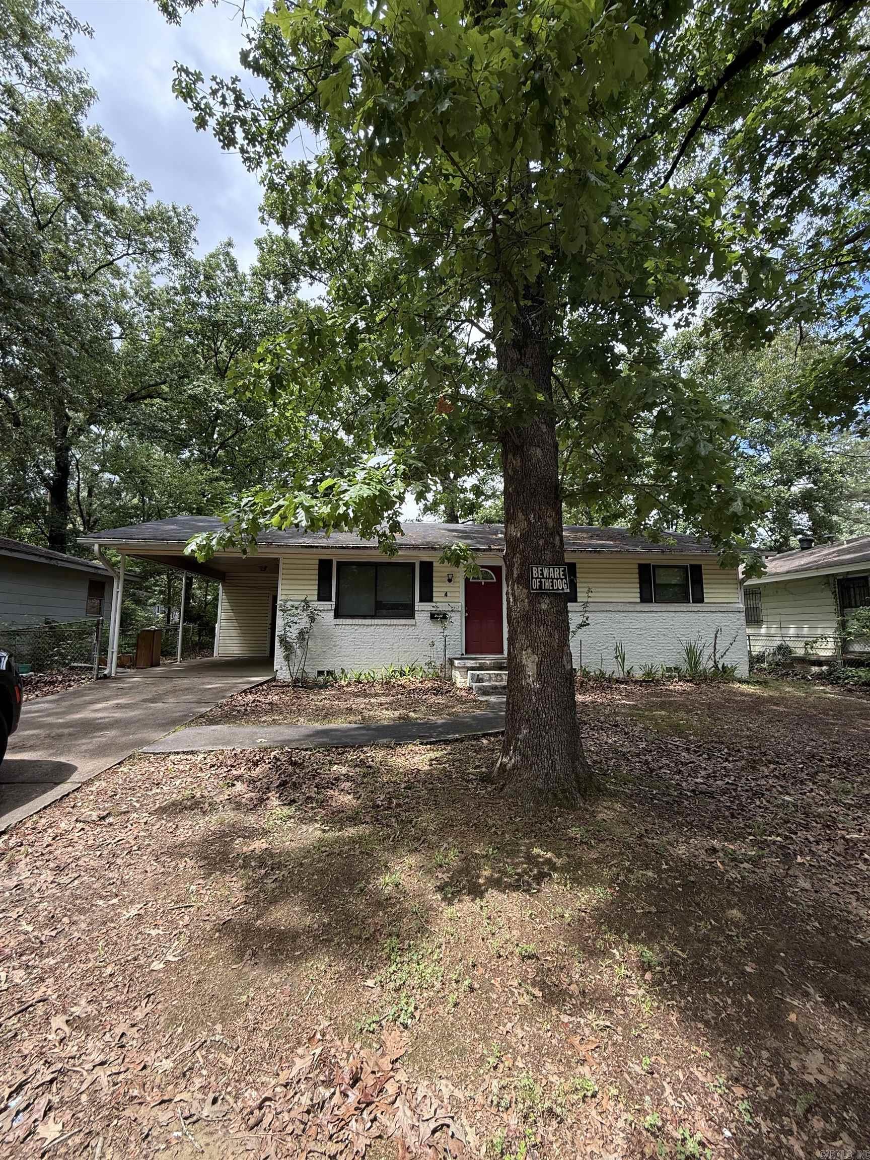 Ideally located in the established Wakefield neighborhood, this adorable 3-bedroom, 1-bathroom cottage offers an efficient and comfortable living space. The 875-square-foot interior features an inviting eat-in kitchen and a practical layout perfect for those seeking an entry-level home or a solid investment opportunity. Outside, the property includes a secure carport and a fully fenced backyard on a manageable 0.17-acre lot, providing a safe space for pets and outdoor play. Residents will appreciate being just a short walk from local neighborhood parks and the community activities at the Southwest Community Center. This home is exceptionally well-positioned for commuters, located just minutes from the major retail corridor on 65th Street and the Geyer Springs Road exit, with rapid access to I-30 and I-430 for a direct route to downtown Little Rock and the University of Arkansas at Little Rock