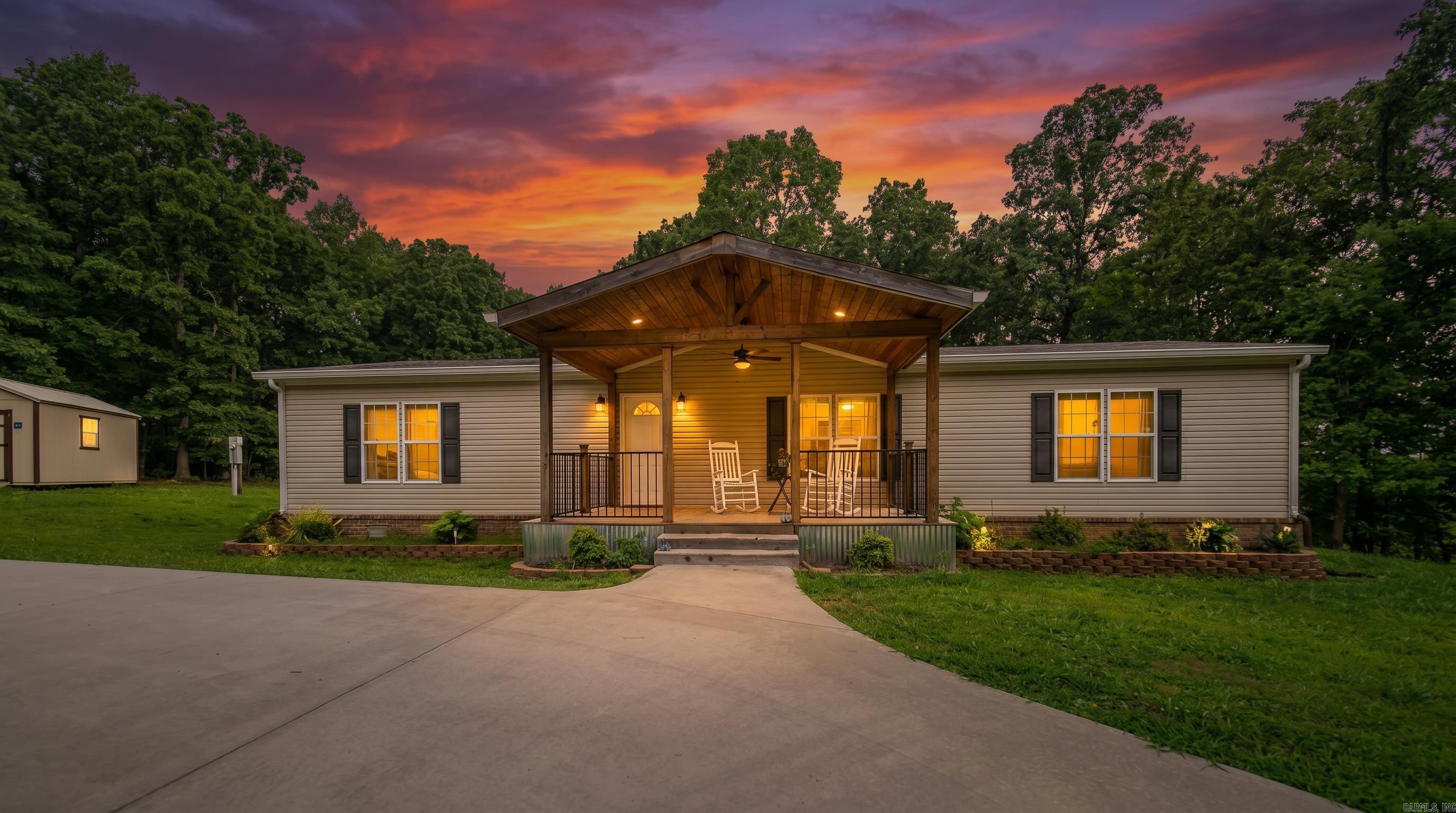 Country Home in the Ozarks Enjoy the peaceful lifestyle you've been searching for with this well-maintained 3-bedroom, 2-bathroom home situated on 2.4 beautiful acres. Offering 1,620 square feet of comfortable living space, this property provides the perfect balance of privacy, functionality, and room to enjoy the outdoors.  Inside, you'll find a welcoming layout designed for everyday living, while outside you'll love relaxing on the inviting front deck or spacious back porch overlooking the scenic acreage. The paved circular driveway provides easy access and plenty of parking for family and guests, while the moveable carport adds flexible covered parking options. A detached outbuilding offers excellent storage or workshop space for hobbies, tools, or equipment.  The usable acreage provides endless opportunities for gardening, outdoor recreation, or simply enjoying the quiet country setting. Whether you're looking for your forever home, a peaceful retreat, or a property with room to spread out, this country home offers the space and features to fit your lifestyle.
