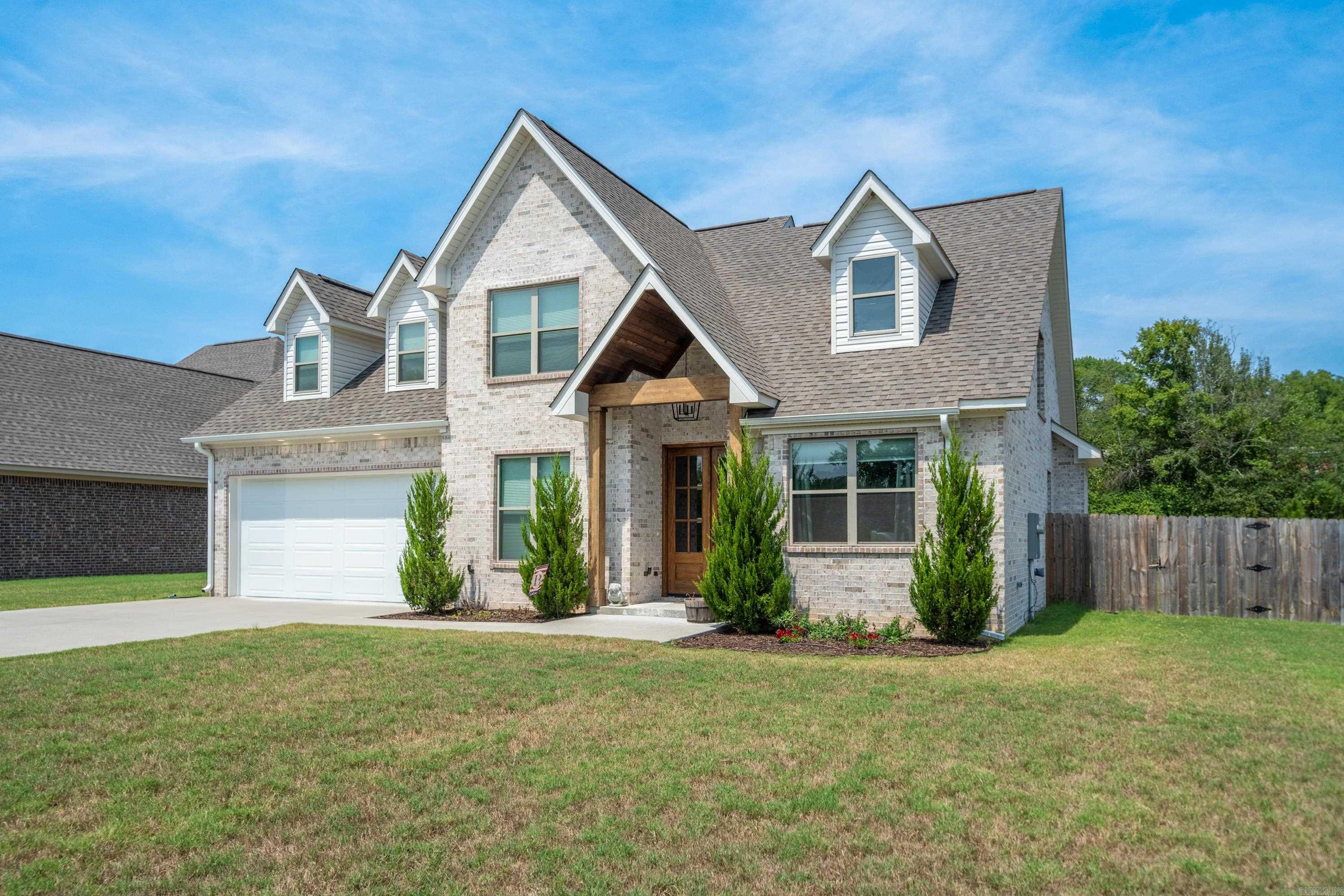 Built in 2022, this stunning two-story modern rustic home offers the perfect blend of cozy charm and upscale design. Ideally located just 5minutes from Oaklawn, 10 minutes from Downtown Hot Springs, and only 45 minutes from Little Rock, you’ll love the convenience of this safe, quiet neighborhood—with no HOA. Spanning 2,829 square feet, this beautifully crafted home features 5 bedrooms, 2.5 bathrooms, a dedicated office, and a huge den, all designed with custom finishes and thoughtful details throughout. The open-concept main level showcases rustic wood beams, an impressive all-rock gas fireplace, live-edge countertops, and abundant windows that fill the home with natural light. The vaulted master suite serves as a private retreat, complete with an oversized soaking tub, walk-in shower, and private toilet room. A spare bedroom and office are also conveniently located on the first floor. Upstairs you’ll find a 500 sq. ft. bonus room, along with two additional bedrooms, including one with a spacious walk-in closet. Built with quality and care and kept in immaculate condition, this move-in-ready home offers modern comfort, rustic charm, and an unbeatable location.