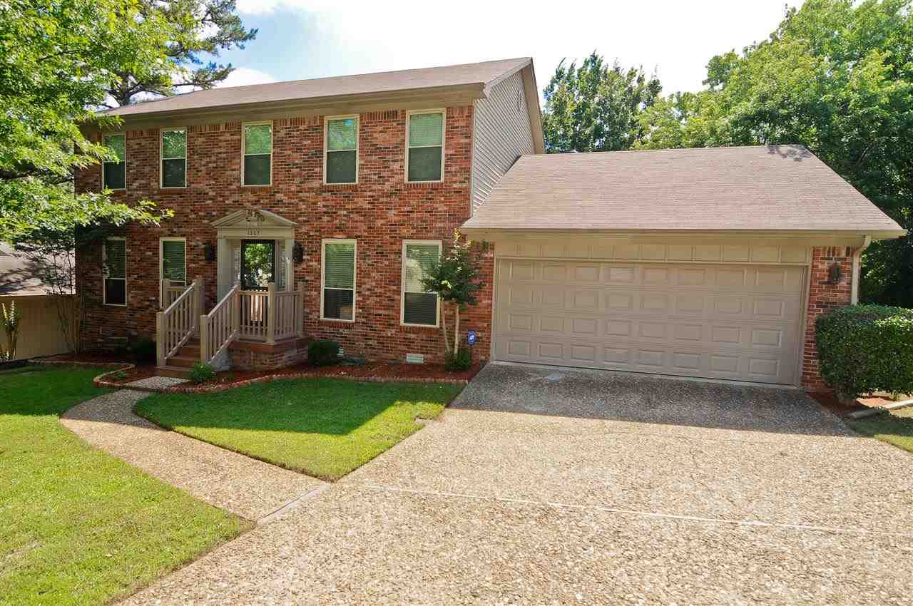 Immaculate all brick home w/ beautiful wood doors, trim work, crown, & moldings throughout. Features include 2 living areas, formal dining, eat-in kitchen, screened back porch, antique finished deck, natural gas grill hookup, & workshop room in garage. Updates & improvements include wood floors, vinyl tilt in windows, remodeled master bath, paint, carpet, furnace, AC, stainless steel appliances, front porch w/ TAMKO railing & tile, tile floors in bathroom, & new screens on back porch. See agent remarks...