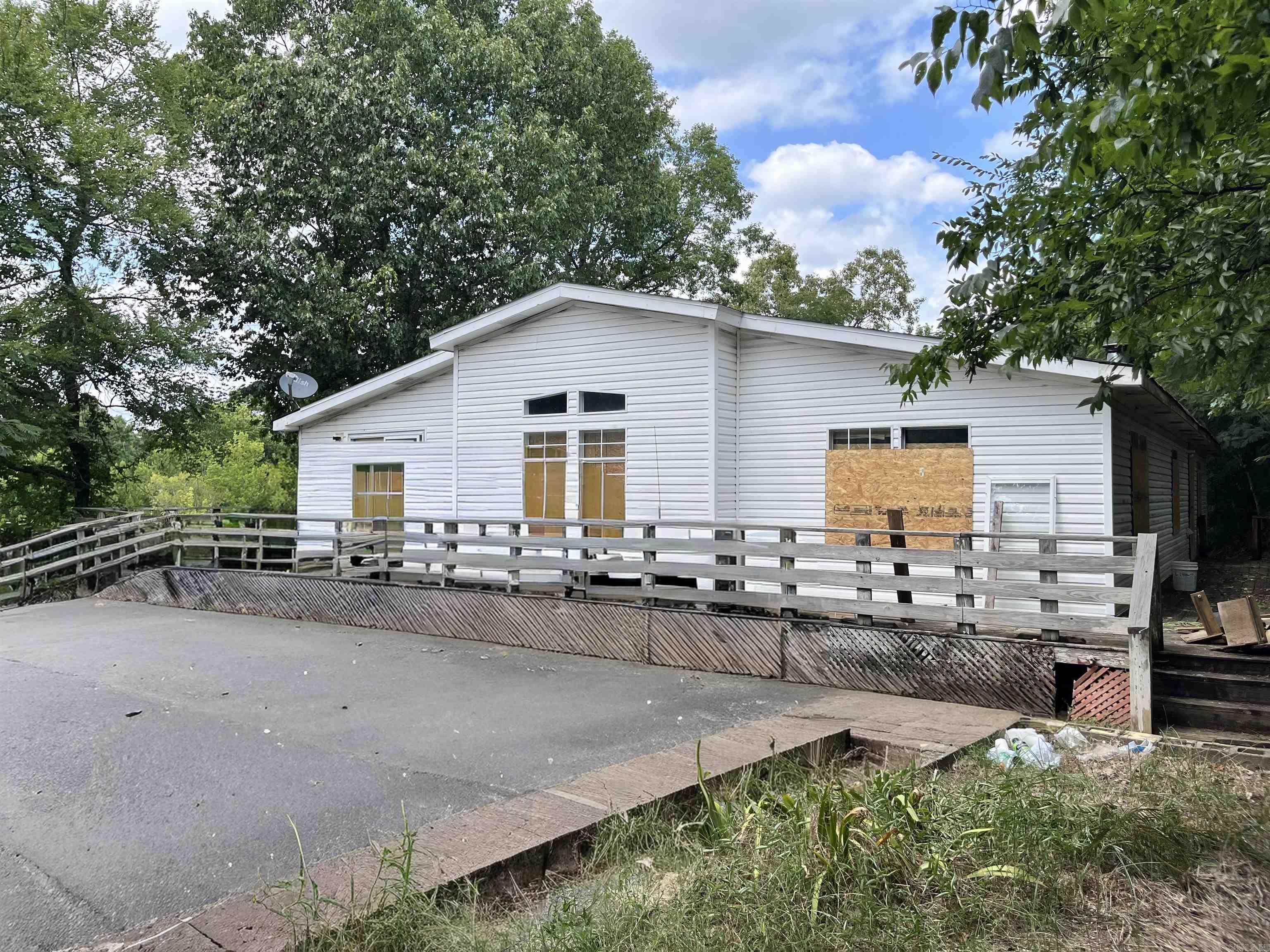 Hi, I'm 294 Ledgerock Road. Tucked away outside Hot Springs city limits, I offer a peaceful setting with the added bonus of partial lake frontage, creating the perfect backdrop for your future plans. Whether you're dreaming of building, investing, or simply owning a piece of Arkansas's natural beauty, there's plenty of opportunity here to make those dreams a reality. Enjoy the privacy of a tucked-away location while still being just minutes from the shopping, dining, recreation, and entertainment that make Hot Springs such a desirable place to call home. If you've been searching for land with character, potential, and a touch of waterfront charm, I'd love to welcome you home. Come explore the possibilities at 294 Ledgerock Road!