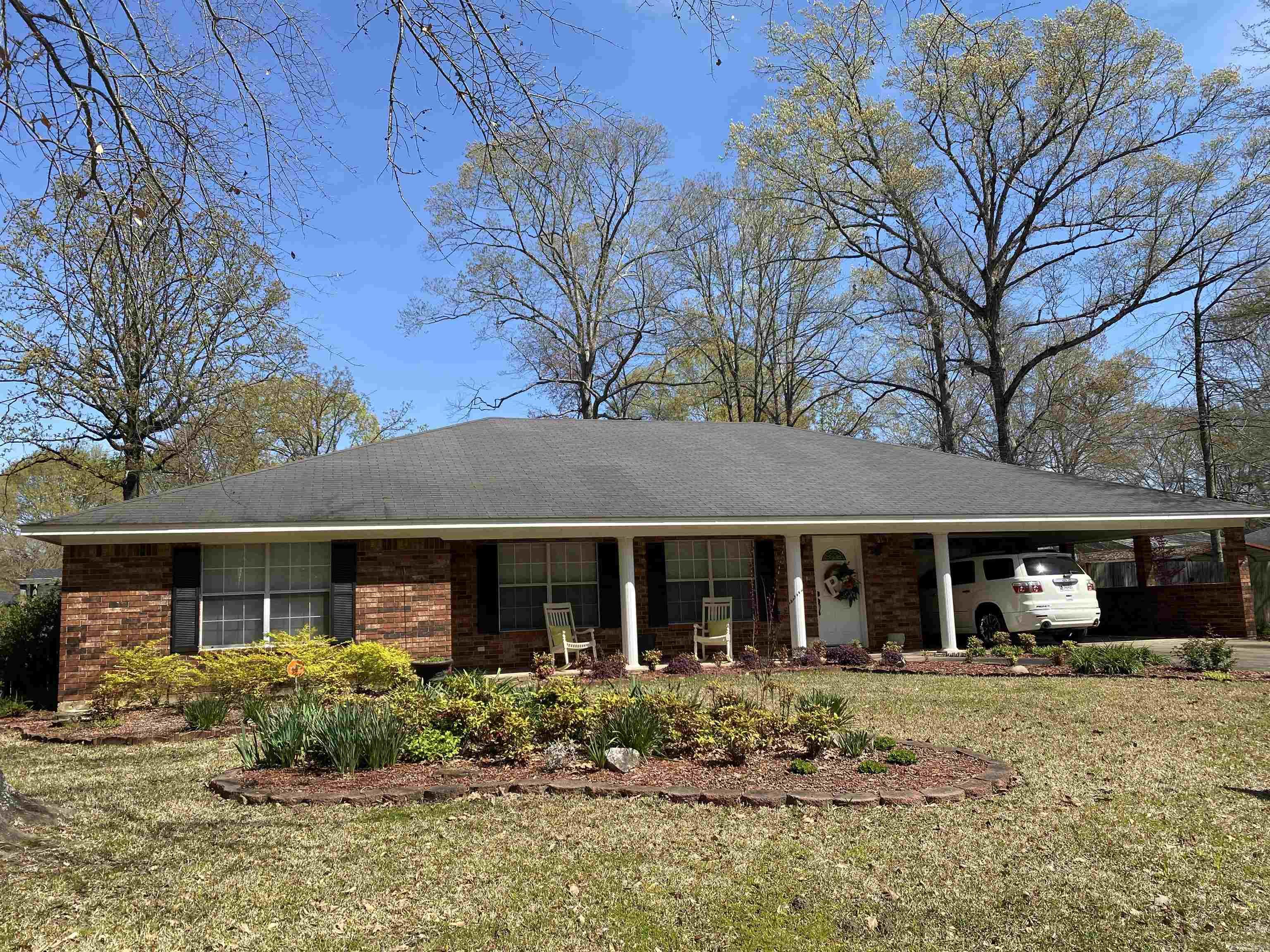 Immaculate condition, well-maintained traditional-styled 3 bedroom / 2.5 bath brick home on privacy-fenced yard with shop and additional storage building. Desirable floorplan. 3 large bedrooms all with walk-in closets! The hall bath is spacious with shower/tub combo and double sink vanity. Master bathroom has walk-in shower and double sink vanity. 1/2 bath located in laundry room. Eat-in kitchen with breakfast bar and dining area open to formal dining room. Den with built-in entertainment center. Opening from the den is a cozy and inviting covered patio and beautifully landscaped backyard. The 20x20 shop has electricity, shelving and rollup door.  Roof 2008; Central HVAC 2011; HWH 2024; Dryer vent exhaust motor Nov 2025.