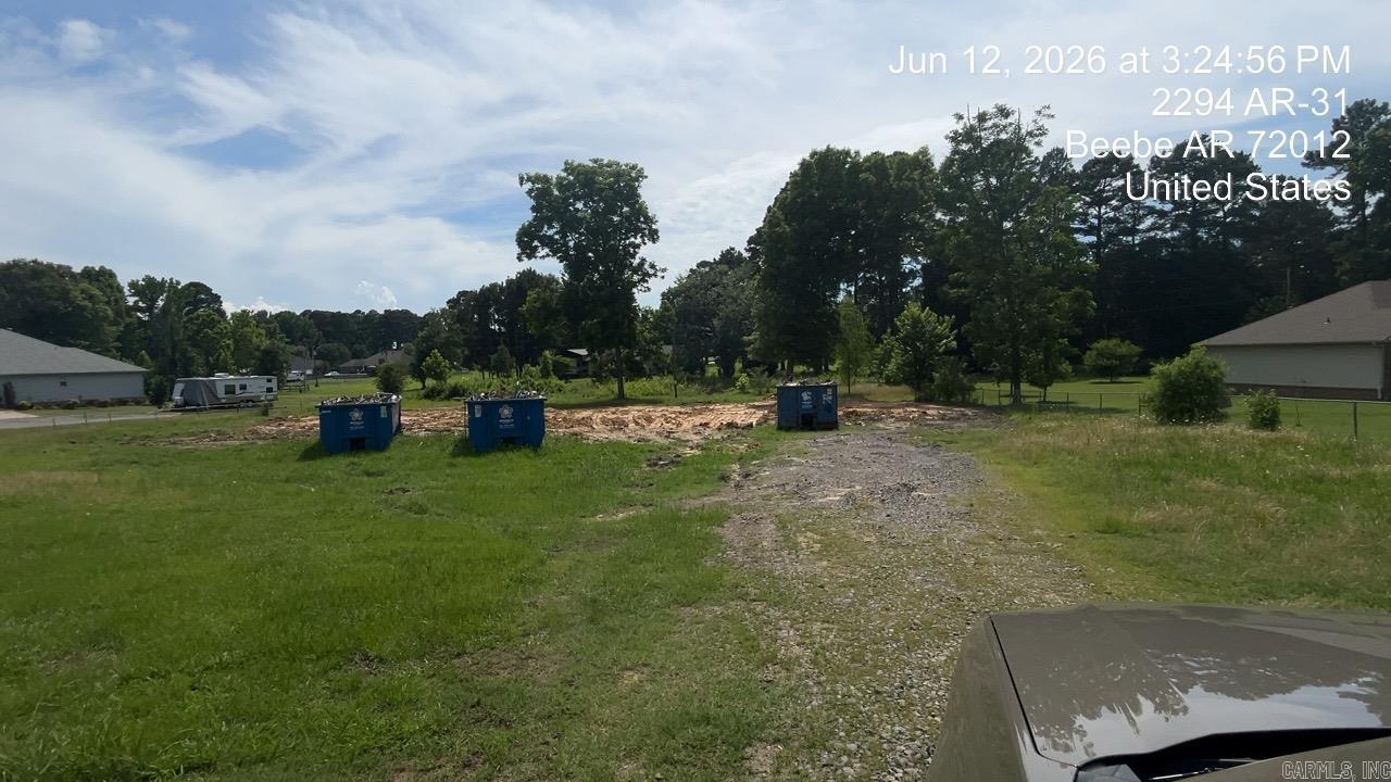 Property left from home burning down.  Property is completely fenced and has utilities and septic.  No warranties .  Additional docs required, proof of funds and earnest money to be presented with all offers.  Taxes are unknown since home burned.  Condition of utilities are unknown.