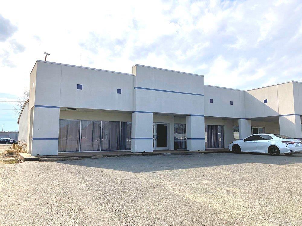 Commercial Building for Sale.  The front showroom is leased as a training center and has approximately 4000 square feet.  The back portion of the building is leased and has approximately 4000 square feet.  Another 1800 square feet is available to rent to create additional rental income.  According to tax records, the square footage of this building is approximately 9,853 square feet.  Monthly income on the two leased spaces is $1,900 per month.    This is a great opportunity for an investor to purchase the building and have immediate cash flow.  Note that the adjoining building at 2500 E Hardine Avenue has over 14,000 square feet should you need more space. Both buildings can be purchased together with a total square footage of approximately 24,000 square feet.