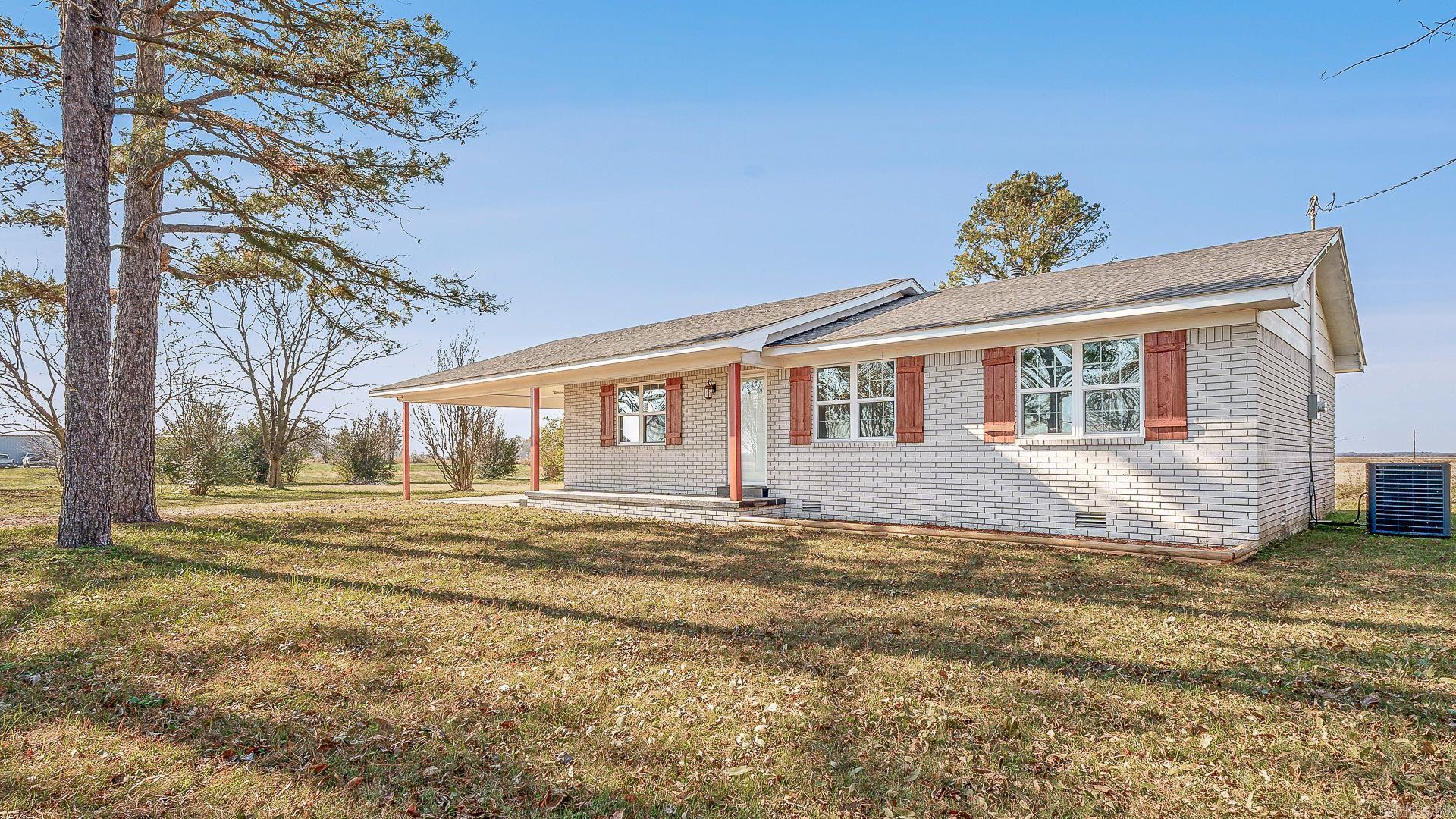 This exquisite completely remodeled 3-bedroom, 2-bath Brick home with 2-car garage. This house has new kitchen cabinets and appliances. House is very open with a large dining and living room., This house has all new upgraded flooring through-out the house. Indulge in the luxury of the owner's tranquil sanctuary to unwind in the nearly 1-acre, with shade trees. This house has all new plumbing, a new roof, new water heater and the wiring was updated. Through-out the house you will see all new lighting, and both bathrooms have been totally updated. This is an energy efficient home with central heating and air. Has a large back patio with roof. There is also a 20 x 30 out-building . Don't let this exceptional opportunity slip away from your viewing today!