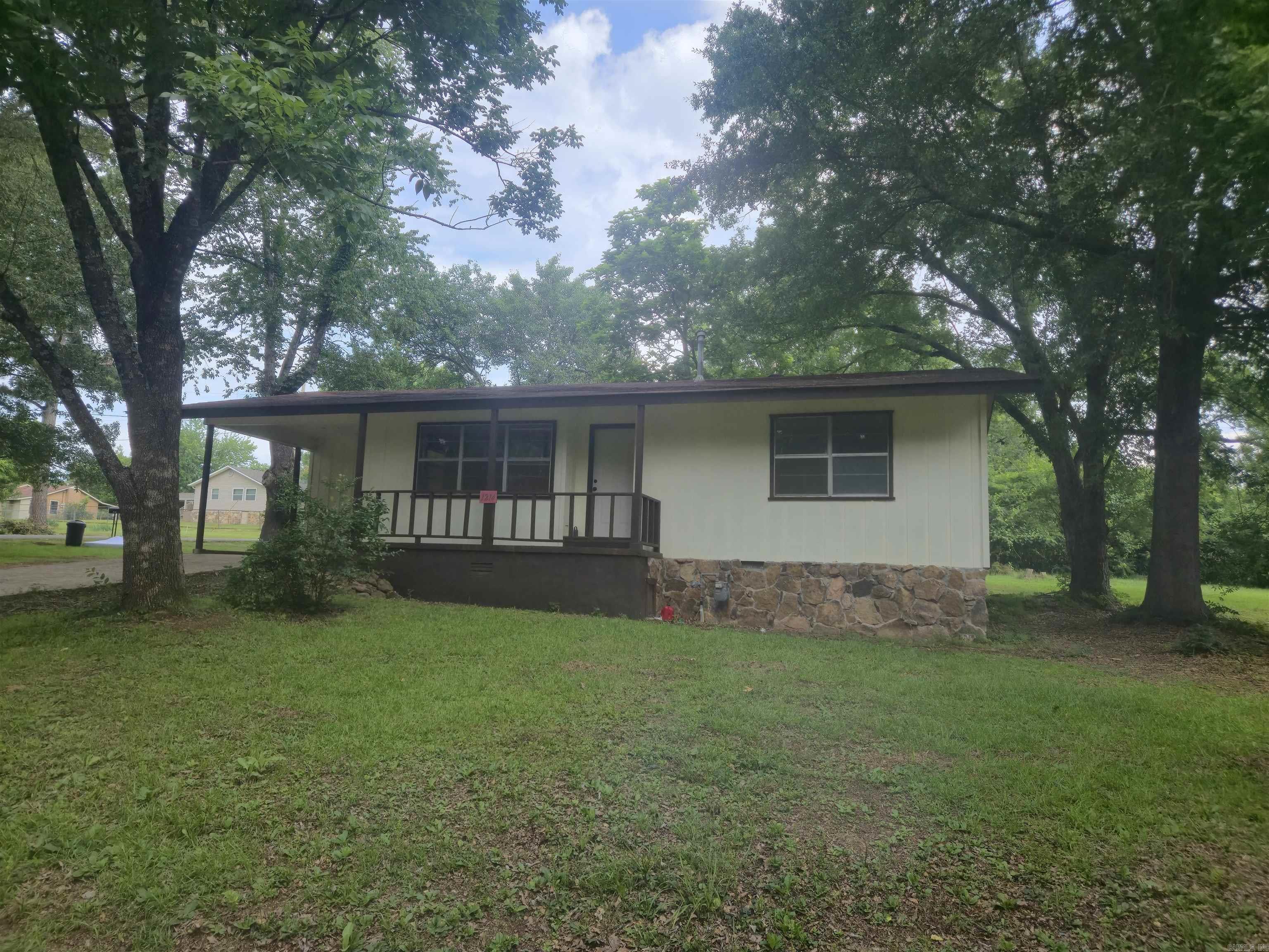 Welcome to this charming home in the heart of Heber Springs, offering comfort, character, and room to make it your own. Whether you're looking for a move-in ready home or a property with potential for future updates, this one offers the best of both worlds.  Featuring 2 bedrooms and 1 bathroom, the home has a comfortable layout and a screened-in back porch that's perfect for relaxing and enjoying the outdoors. Situated on 2.5 lots on a quiet corner, you'll appreciate the extra yard space, privacy, and possibilities that come with a larger property.  The home is move-in ready and includes window units, a gas heater in the main living area, and all appliances will convey with the sale. The seller is also open to discussing the addition of an HVAC system with an acceptable offer.  Perfect for first-time buyers, investors, or anyone looking for an affordable home with charm and potential, this property offers a great opportunity in a convenient Heber Springs location.