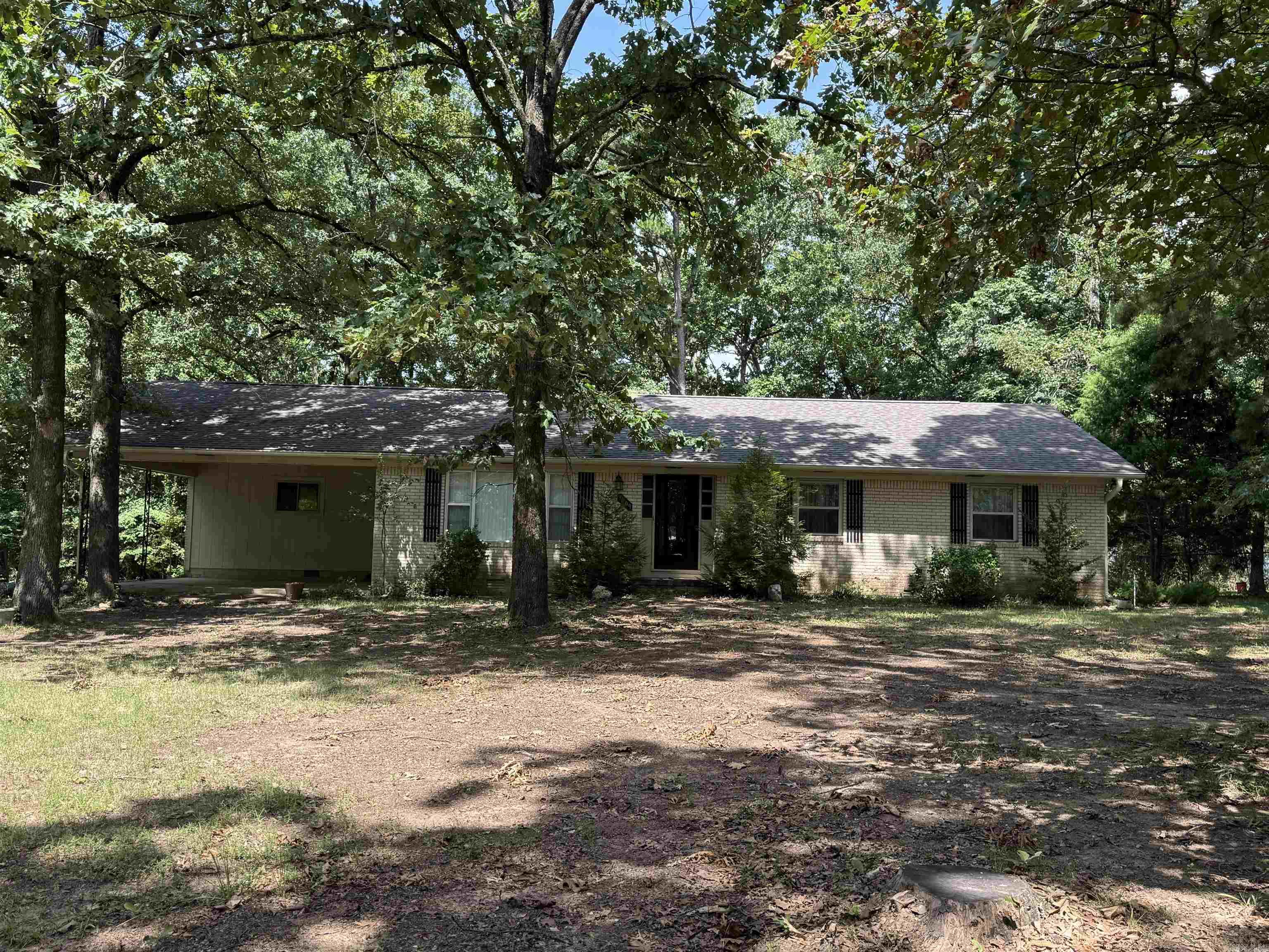 Great 1 owner home that has been well maintained over the years.  There is plenty of room to roam with this country feeling home that is located between Benton and Bryant in Hurricane Heights right off of Highway 5. There is .91 of an acre here with a shop with electricity and a separate large RV or boat cover.  The home has a great layout with newer LVP flooring located int the living areas of the house. There is a living room, breakfast room, dining room, breakfast bar, and a separate laundry room!  Take a look at this house that is waiting for you to call it HOME!  There are 2 lots located behind the house on Huffman that are listed.