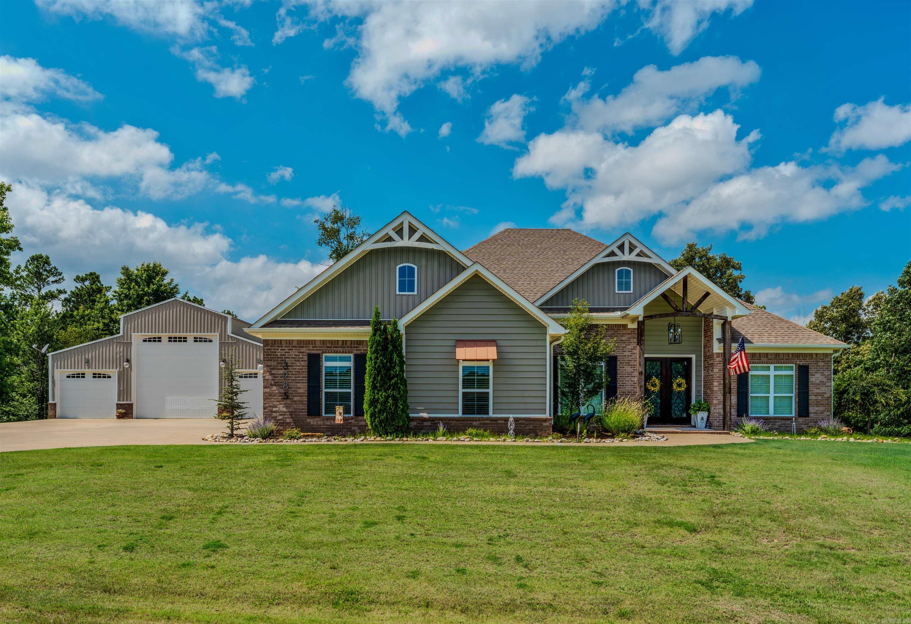The perfect blend of country living and modern comfort with this beautiful 4BR, 2.5 BA..open floor plan features a gorgeous kitchen with abundant cabinetry and huge island, quartz countertops and plenty of space for entertaining. The spacious family room boast a coffered ceiling and WBFP, while the sunroom is filled with natural light and includes a second WBFP..The private primary suite offers a luxurious bath and oversized  walk-in closet...All hardwoods and tile in baths & laundry.  Screened in porch offers peaceful mornings and afternoons.  40X47 incredible shop with 220 volt electricity, water and sewer clean out for RV.  This shop is amazing for RV & wood shop and storage!!  This property offer space, functionality and charm you'll appreciate every day!!  Hurry to see...Agent see remarks for more amenities.