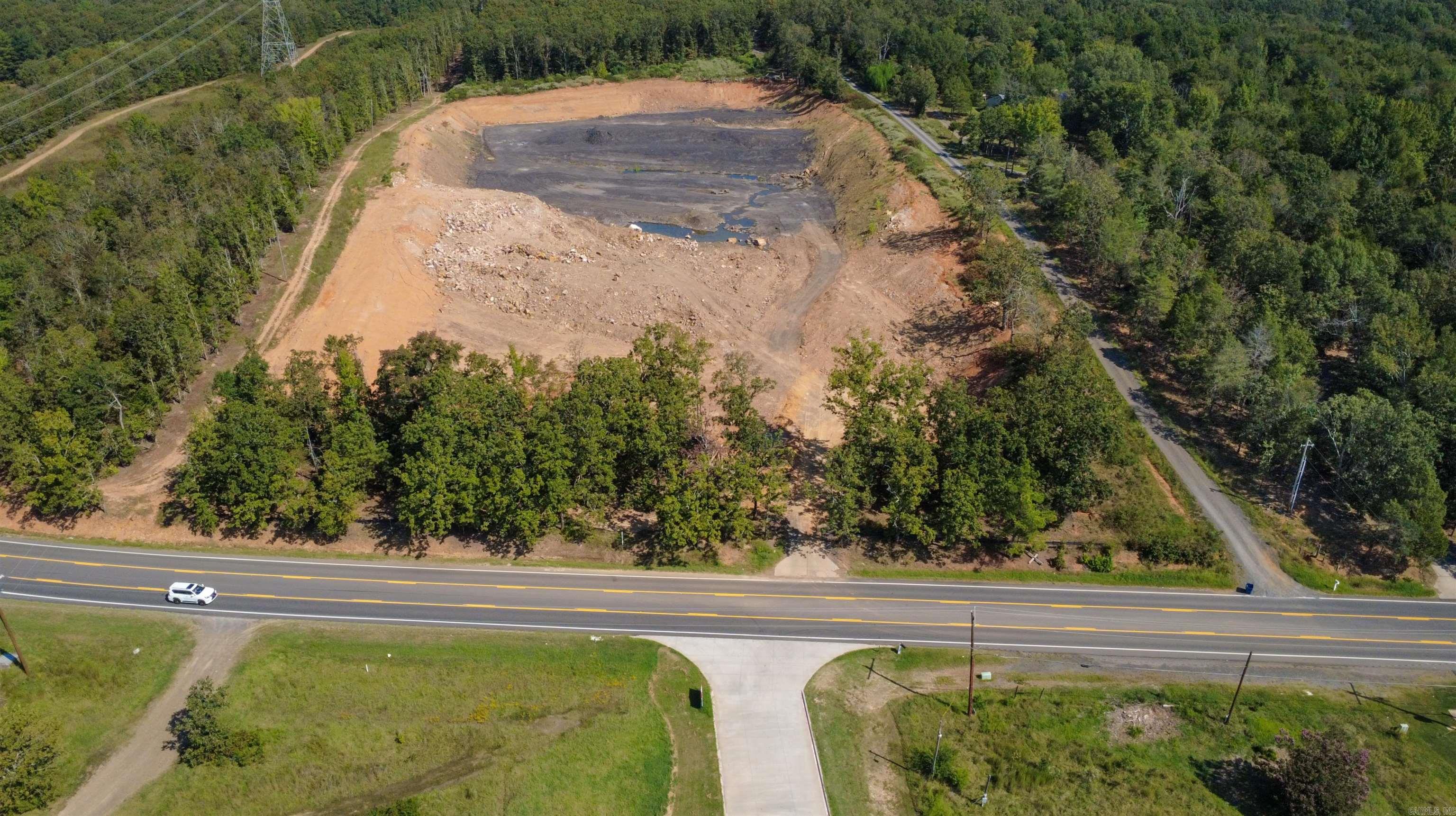 Commercial property located in a prime area along Main Hwy in the City Limits of Cabot, just a minute from the freeway,  There is 9.68- Acres zoned C-2 with est. 300 ft of Highway Road Frontage on Hwy 89 (Main Street) which is the main road traveled between the Freeway and Hwy 5.  LOCATION,LOCATION,LOCATION!! City Water and Electric already on Property. Property is across from Atwood's... Also across from or adjacent to Several other Commercial Businesses including Banks, Shopping, Restaurants, coffee shops, office spaces... Call Today and bring your business to this amazing spot.  This property has a lot of filling material on site to be able to grade the property to what you need  SEE AGENT REMARKS