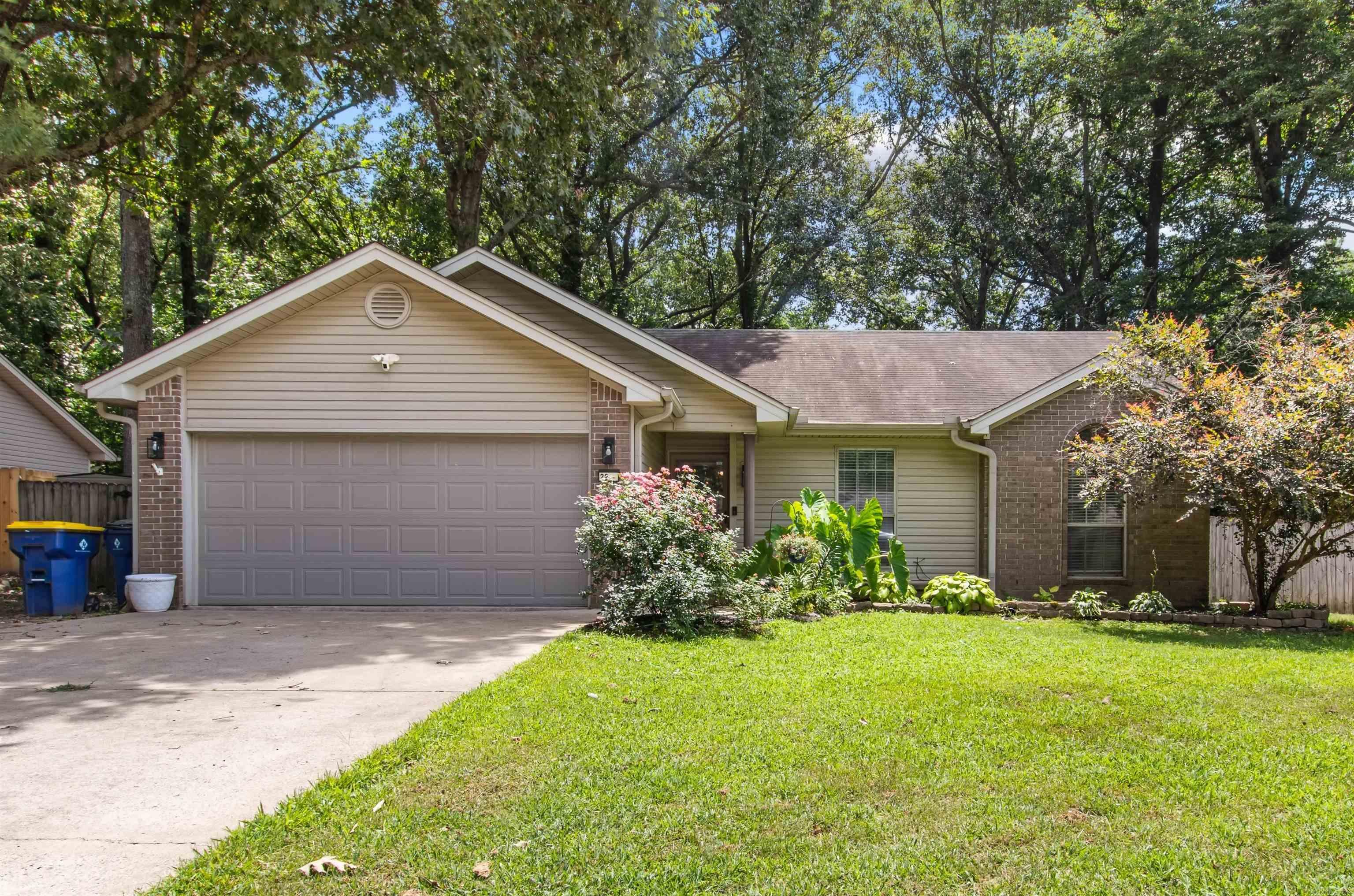 This charming 3-bedroom, 2-bath home is full of character and move-in ready! From the moment you step inside, you'll love the inviting living room featuring a soaring vaulted ceiling, a beautiful exposed beam, and a cozy fireplace with a brick surround that creates the perfect focal point. The functional floor plan offers comfortable living, while the backyard is ready for relaxing and entertaining with a fully fenced yard, a spacious storage building, and a fun deck bar area that's perfect for grilling, watching the game, or enjoying evenings with friends and family. Additional features include a NEW HVAC system (2024) for added peace of mind, plus gutters with leaf guards to help make exterior maintenance a breeze. Whether you're looking for your first home, your next home, or a low-maintenance place to settle in, this one checks all the boxes. Schedule your private showing today!