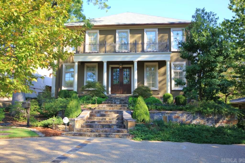 Wonderful home in Heights w/ great street appeal and outstanding flr plan. This home provides the ultimate space for entertaining friends.  Beautiful dining room with marbled columns & chandelier. Luxurious master suite on main level. Stunning gourmet kitchen with breakfast is open to great room w/ fireplace & overlooks flagstone patio with outdoor fireplace. Huge den, upstairs, complete with full wet bar, dining area and game area. Handsome wood-paneled Study with wall of bookcases.  Detached 2 car garage