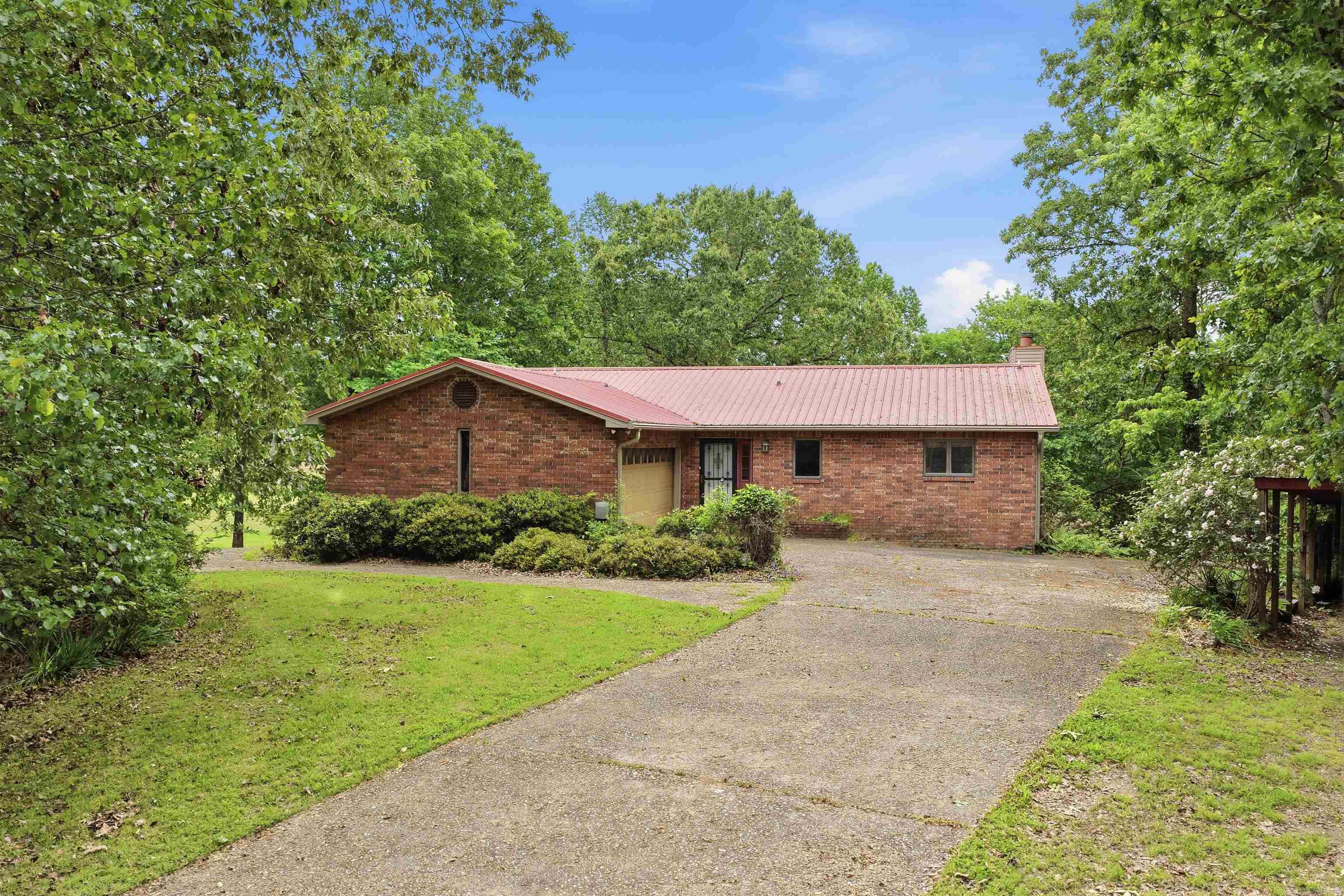 Golf course living in beautiful Hot Springs, Arkansas! This 4BR, 3 bath, 2-story home on 2 lots is perfectly positioned on a PGA-sanctioned golf course, offering stunning views & an unbeatable lifestyle.  Step inside to discover a spacious & functional floor plan designed for a variety of living options. Main floor has 2 BR/ 2 BA w a sunroom & deck, both with views of the golf course. Also on the main level is a livingroom/dining/kitchen open to each other. Downstairs are 2 addl bedrooms, a bathroom, & a game room. This home generously provides flexibility for everyone & space for a home office.  Enjoy nice mornings overlooking the fairway & relaxing evenings w golf course sunsets right from your back yard. Whether you're an avid golfer or simply love green space, this location delivers both privacy & scenic beauty.  Residents also enjoy an opportunity for access to outstanding community amenities including a clubhouse, swimming pool, pickleball courts, basketball court, picnic pavilion, & play ground. (for details on fees etc. visit www.diamondheadcommunity.com) Located in area known for lakes, outdoor activities & vibrant living this is the perfect balance of resort vs comfort.