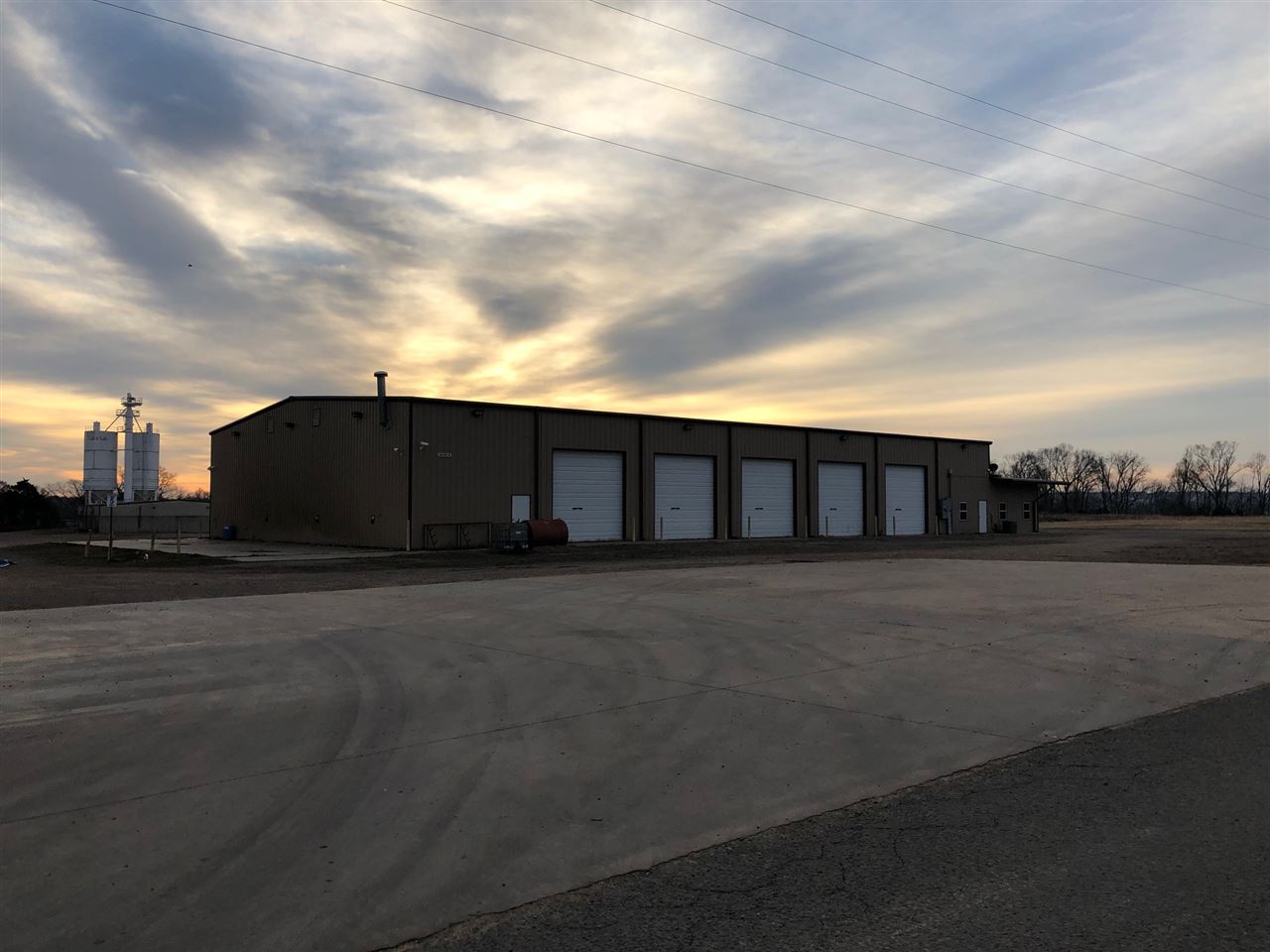 Two Buildings on Ten Acres of Ground which was used for a Trucking Company and a Sand and Gravel Company.  Sand Plant is 20,131 sq ft per tax card includes silos, scales, scale hosue, wash bay, and offices.  The other building is 12,800 per tax card was used for a trucking company, Building has five bay doors and eight offices five bathrooms and upstairs area for office or training.