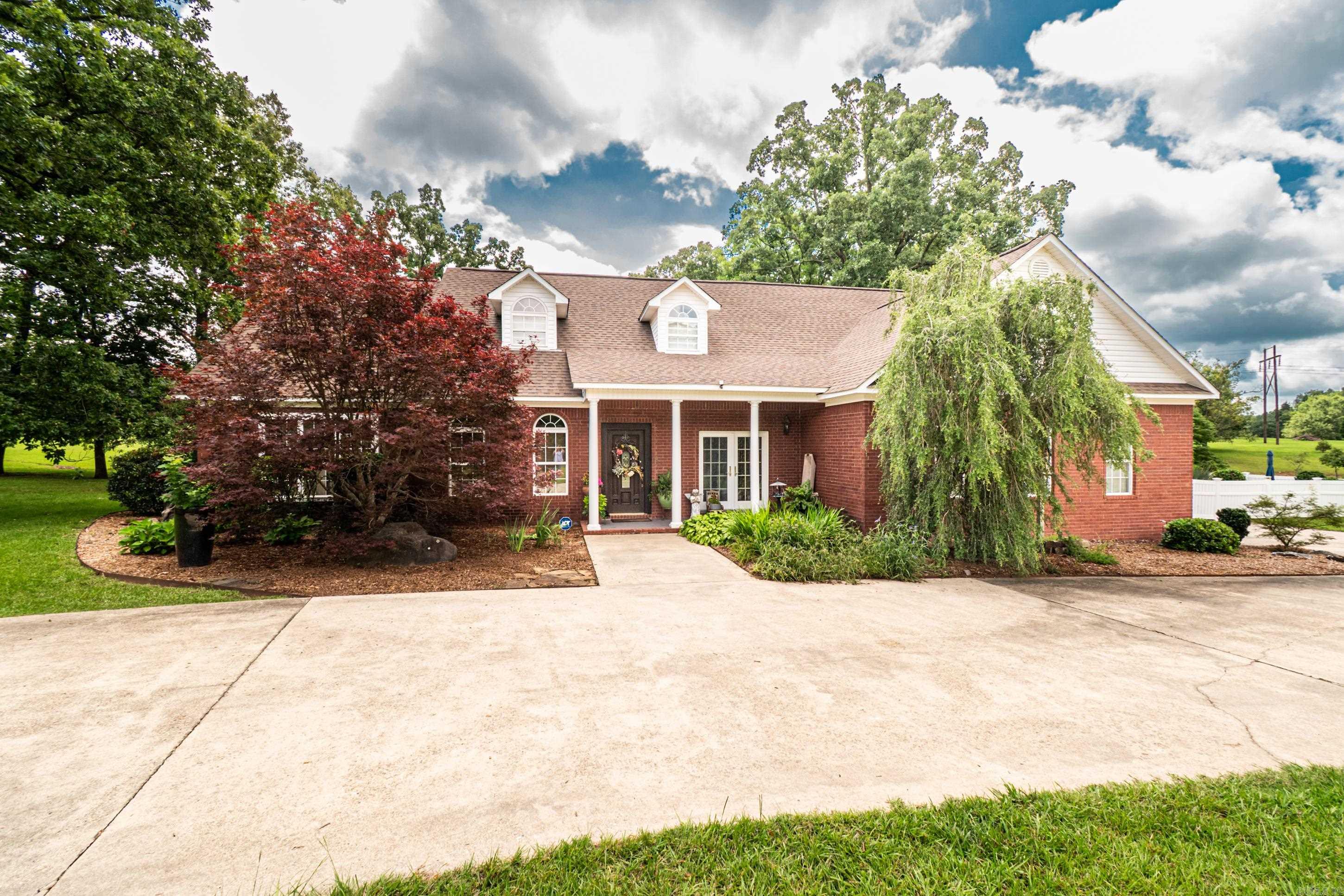 Welcome to 185 Meadow View Drive! This beautiful 4-bedroom, 3-bath home offers the perfect blend of comfort, space, and privacy, all situated on nearly 4 acres just minutes from town.  Step inside to find an impressive main living area featuring soaring 18-foot ceilings that create an open and inviting atmosphere. The spacious primary suite features vaulted ceilings, providing a relaxing retreat at the end of the day. A dedicated game room offers additional space for entertaining, hobbies, or family fun.  The kitchen is designed for both everyday living and hosting guests, featuring granite countertops and a sought-after Sonic-style ice machine. Outside, you'll enjoy your own private retreat with a saltwater pool, firepit, and plenty of room to roam on the expansive lot. A storage building provides additional space for tools, equipment, or hobbies.  Recent updates include a new roof, fresh paint, and newly installed carpet, making this home move-in ready.  **Mobile Island in the Kitchen doesn't remain.