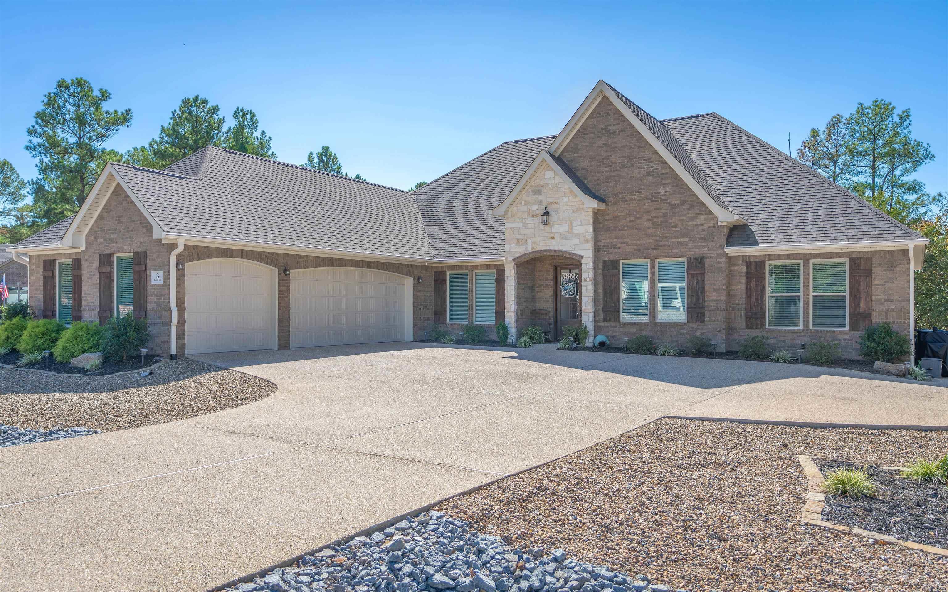 Gorgeous 3 year old Carriage Custom Homes charmer on Huge Corner Lot near Lake Maria and the East Gate! Quality Finishes throughout! Wood Inlayed Foyer Ceiling, Crown Molding, Rounded Corners, Classic Pillars, Gridded French Doors to the Den. Granite Kitchen Island/Eating Bar is Open to Living Room with Cathedral Ceiling and Gas Fireplace! Spa-like Ensuite with Huge Walk-in Closet! Extensive use of Brick & Stone on the Exterior and 3 Car Garage! The Screened Porch (not included in sq ft) overlooks the Backyard and Common Area behind this home for extra Elbow Room! Don't miss the Huge Attic Storage Area! (stairs go up from inside the Garage). You won't want to miss this beautiful home!