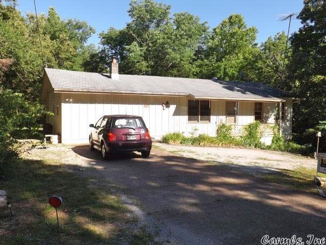Affordable all-electric home on level lot. Located close to Thunderbird Lake, this home has a large open living room/kitchen/dining area, 2 bedrooms, 1 1/2 baths, separate laundry room, and carport converted into a nice office with lots of shelving.  Both the front and back porches are covered, and the home is heated and cooled with by heat pump.  The septic system has a concrete tank, and stove, refrigerator, washer, dryer, and all window treatments stay. Taxes are low, so think full-time or vacation home!