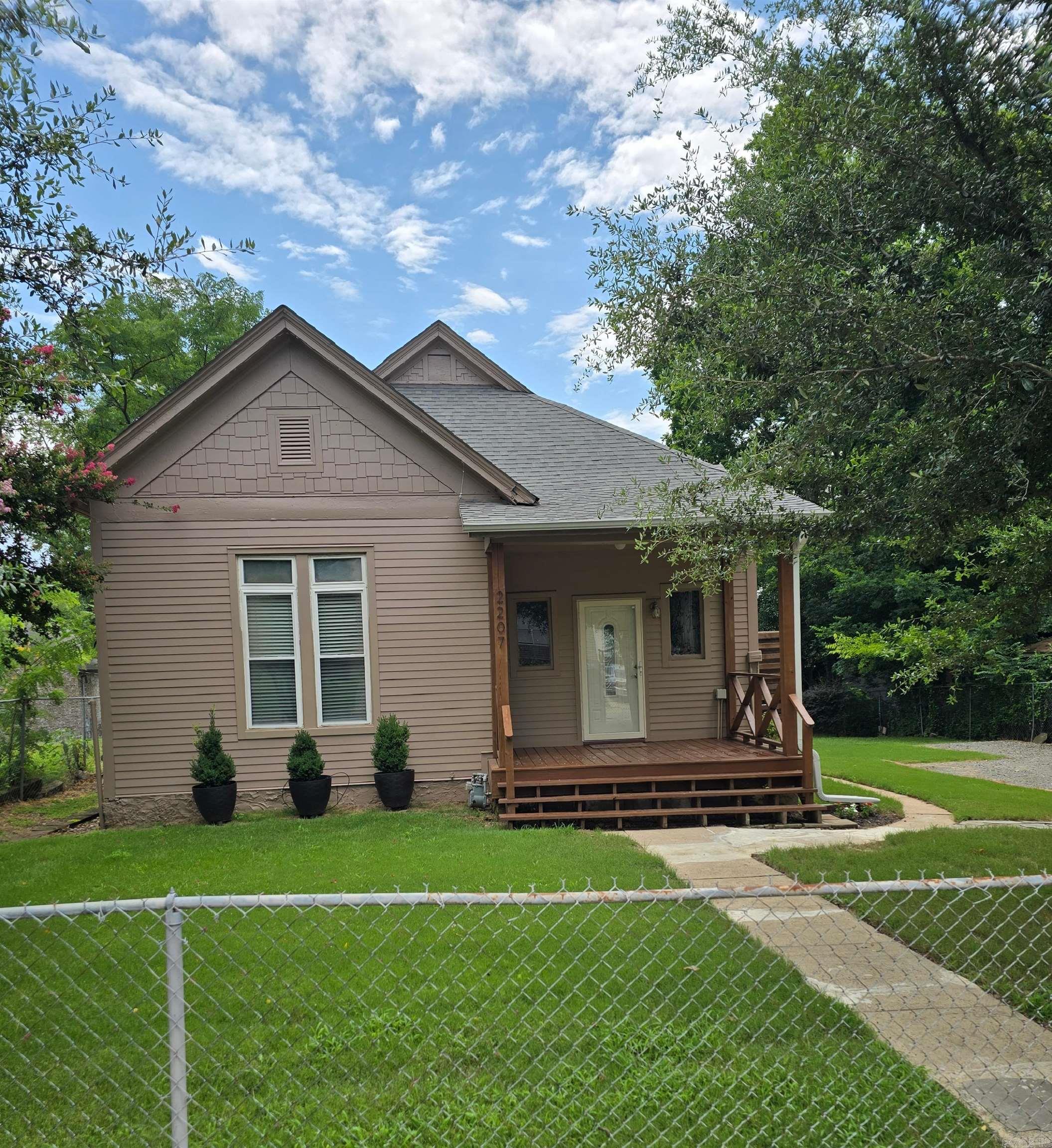 This house is on 1 1/2 city lots with a fully fenced yard. 2 bedrooms and 2 bathrooms. Vinyl flooring in kitchen area and back bedroom. Replacement shower in back bathroom. This approximately 1790 sqft, house has underground utilities, a new water main from street, new sewer line, new HVAC 2016.