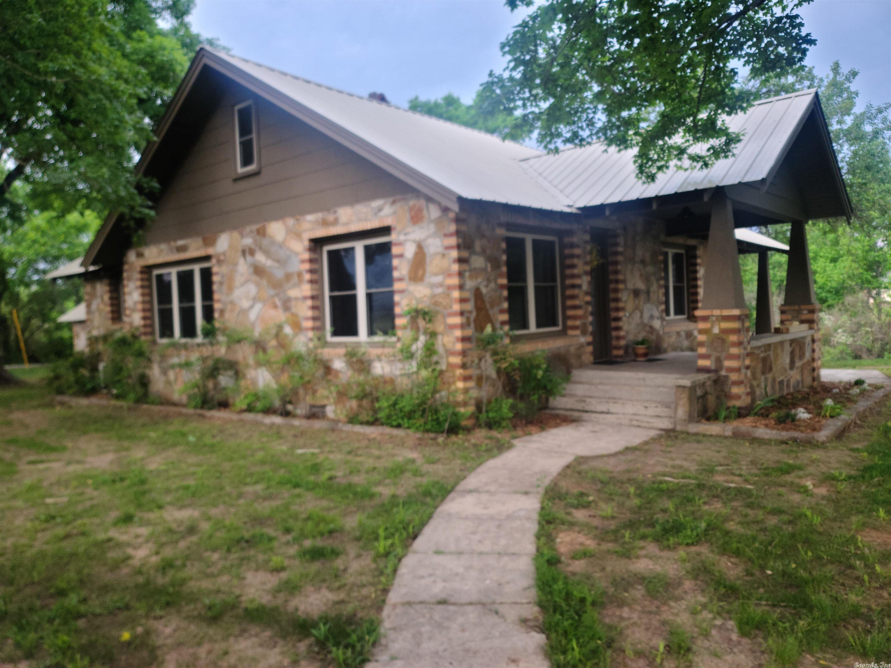 The DALLAS HOUSE!! Currently a vacation rental on Airbnb in the Dallas Community between Mena and Shady.  Convenient to town and Wolf Pen Gap Trailhead off Hwy 375 East.  All new Appliances, All new electrical wiring and plumbing.  Brand new Central HVAC system and Tankless Water Heater. Fresh paint inside and out.  City Water and New Septic System.  Additional blown cellulose insulation in attic. Water well on property for backup.  Current survey.  Level lot for RV's or additional parking. Circle drive for Trailers.  Outdoor living area with grill and gas fire pit.  Fully furnished.  300 SF Finished attic/loft sleeps 4 plus the 2 bedrooms on the main floor.  Small shop with concrete floor perfect for storing atv's/side by sides. House is solid as a ROCK!  Beautiful shade trees and views of the mountains to boot!