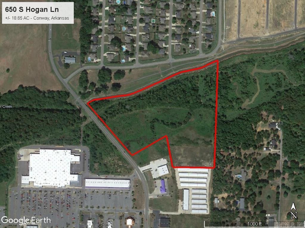 PRIME COMMERCIAL PROPERTY with great development potential. This 18.65 acre parcel of land is located in Conway Marketplace shopping center adjacent to Walmart and other retailers. It features lots of road frontage with excellent visibility in a high-growth area of western Conway. Mineral Rights do not convey.