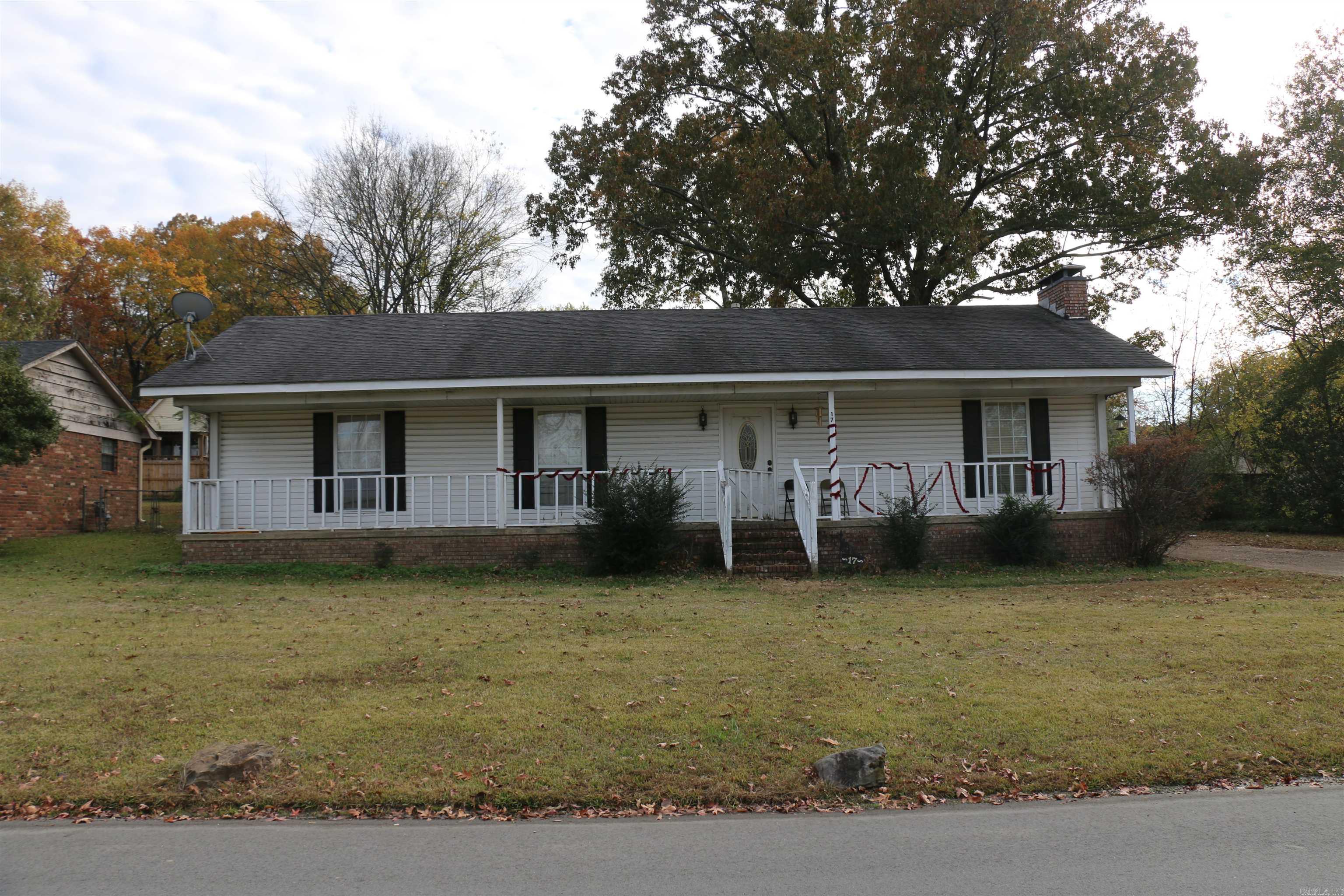 Great location in Bryant close to schools, shopping, dining and commuting! 3 bed/ 2 bath home with spacious backyard that is fully fenced. Full front porch. Open dining and living area with fireplace. Fantastic opportunity for investors. Bryant School District. Priced to sell "As Is".