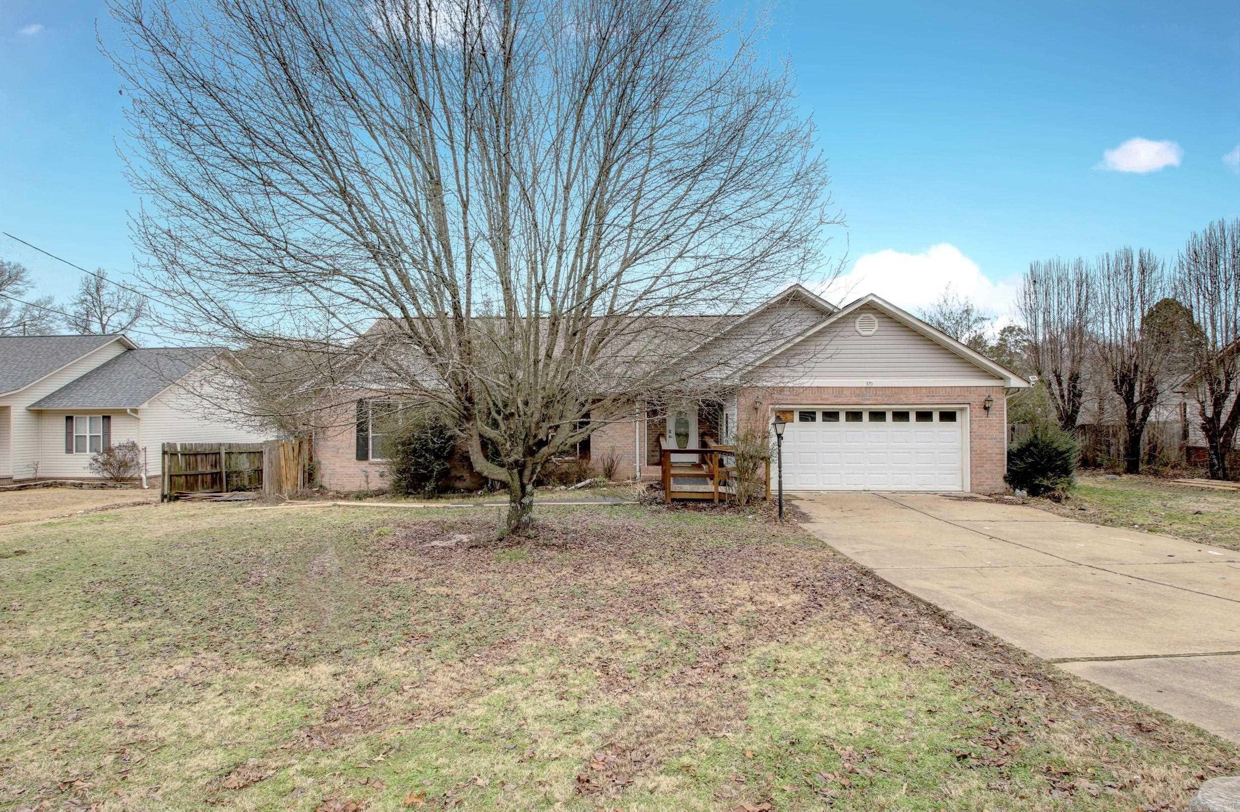 Three bedroom, Two bathroom home located a 4 minute walk to Lake Hamilton with convenient boat launch access, and only moments to dining and shopping, and the interstate. Make this home yours with some TLC.  Huge open living space with vaulted ceilings and nice foyer leading to a living/dining combo area.  The extra large kitchen allows for additional dining space.  This home is being sold ASIS WHERE IS.  Seller will share the inspection report!!  Minor plumbing repairs have already been completed and yard clean up will be competed ASAP.  Schedule your appointment today this one won't last long!! AGENTS SEE REMARKS