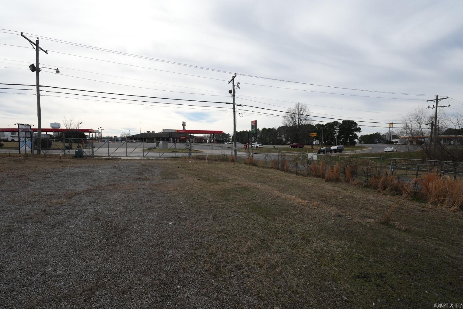 Prime commercial opportunity on approximately 10.8 acres with multiple existing buildings just minutes from I-40 and downtown Russellville. Zoned C-2 and C-5, this versatile property accommodates a wide range of business uses—ideal for industrial, retail, service, or mixed-use development. The site offers excellent access and visibility along Bradley Cove Rd, with utilities on site and ample room for expansion or additional structures. Whether you’re an owner-operator seeking functional facilities or an investor looking for a high-growth corridor near the business corridor and major highways, this property delivers location, flexibility, and long-term potential.