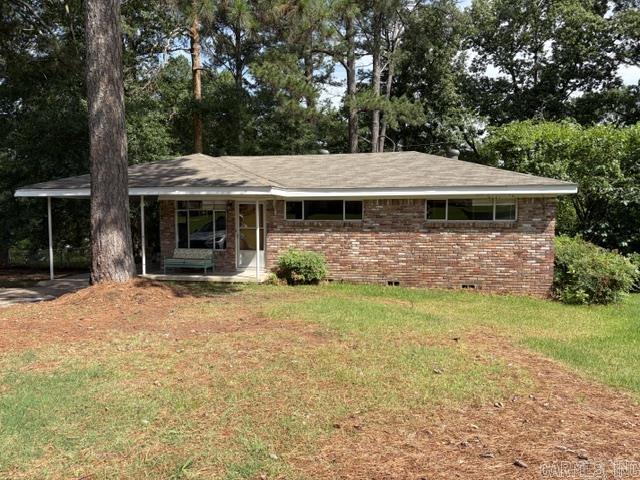 A great starter home, one level, fenced yard. Needs some TLC.  Nice hardwoods. Siding in carport needs replacing. AS IS Seller is in the process of removing Dead tree. Laundry Room is located off of carport.