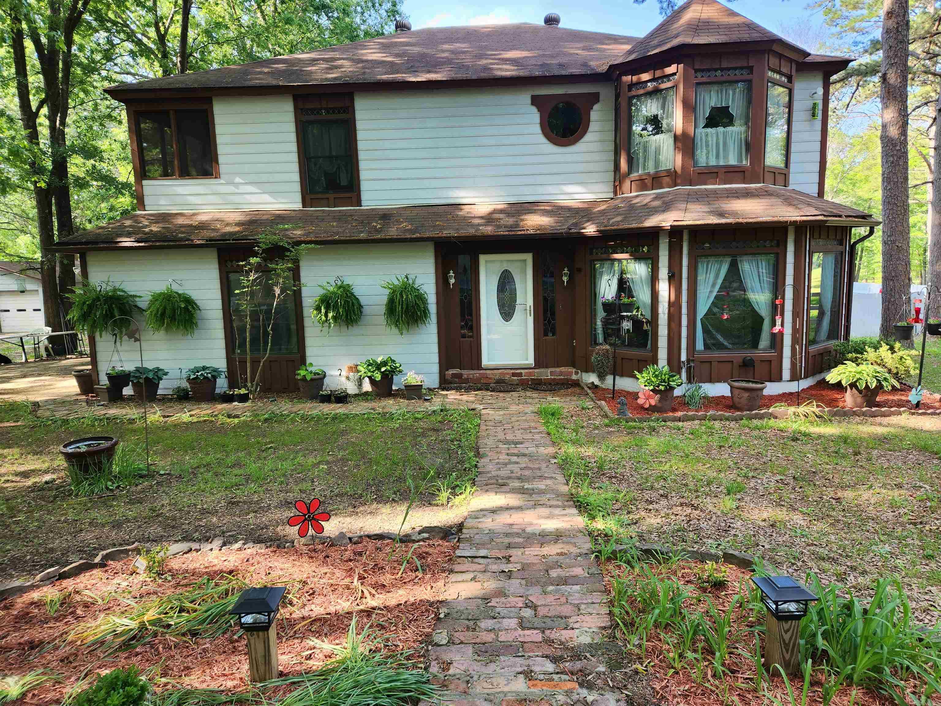 This enchanting Queen Anne-style home sits on 4.94 acres. The property is fenced and cross*fenced with a year-round pond. Perfect for horses. There is a garden space with raised beds filled with rich garden soil. The 2660 sq. ft. 4-bedroom, 2.5 bath home features generous storage, large bedrooms with large closets. The newer Low-E Pella wood windows fill the home with natural light. Recent updates include a new roof, (2024), quartz counter tops in the kitchen and bath, new LVT flooring throughout the lower level and new carpet throughout the upper level. Updates in the primary bath include granite counter tops, new sinks and faucets and the low-entry shower. (2024) Outdoor highlights include the updated 30 X 10 attached screened porch, an attached 2 car garage, a detached 24 X 30 garage/shop and a beautiful 24 X 30 inground pool. (New liner, pump, and filter 2023) Located in the Conway School District. This property offers a peaceful setting with space to enjoy both home and land.