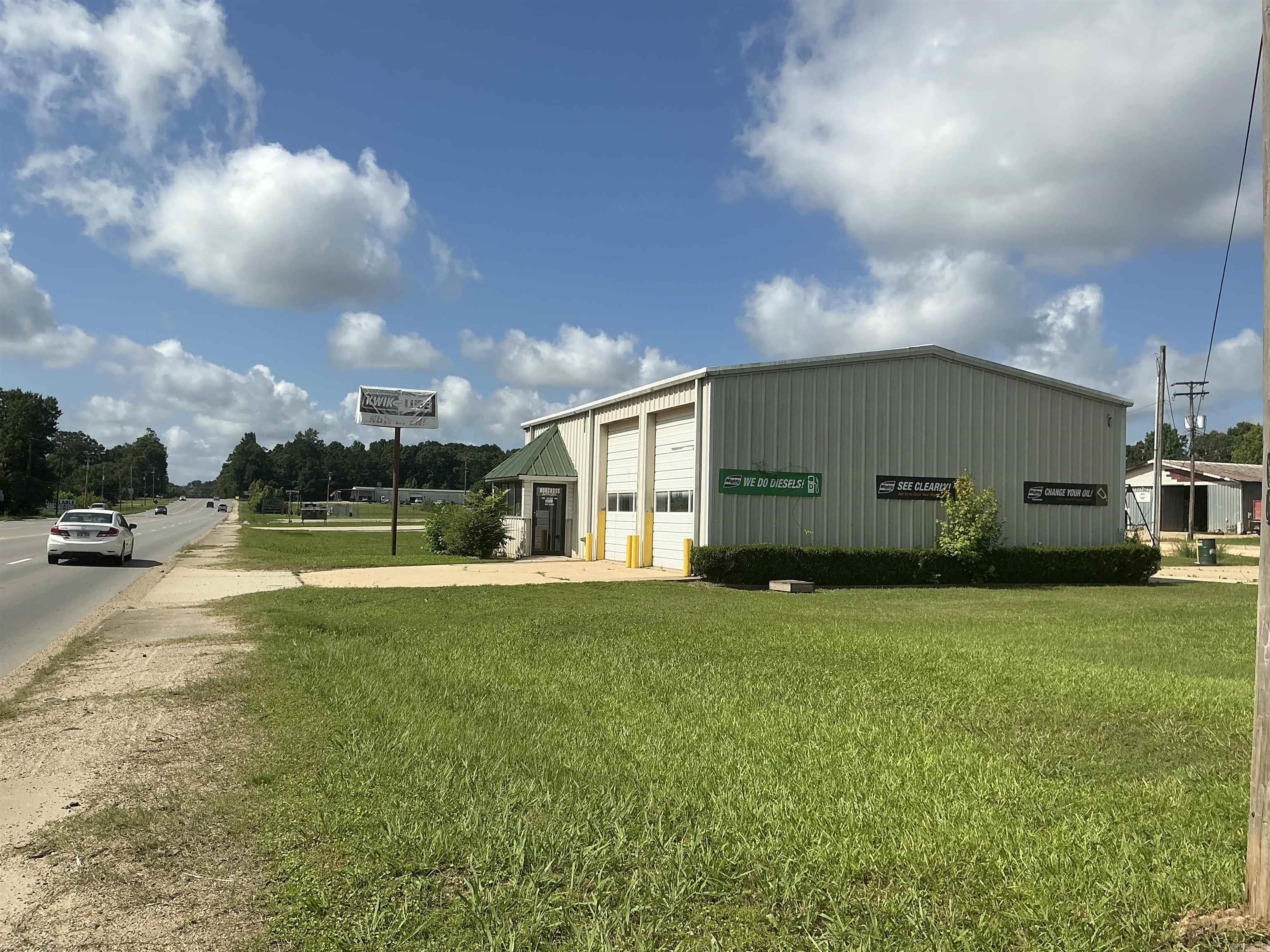 Great Business Opportunity!!! $175,000 and you are set to be in the Oil Changing Business with equipment bought in 2025 and 2026.  You must see this to know what a great set up this business is.  There is the front office, a stock room with shelves, 2 half baths, Storage closets, stairs leading to second floor that features 340 Sq ft of storage, the oil changing area with stairs leading to the oil changing bay.  4 new holding tanks (stocked with oil)  Industrial air compressor (see pictures) new hose reels, holding tank for used oil, new steel racks to work underneath the cars, and much more. Lot is .42 A and has a concrete driveway to enter the business thru two bay doors in the back and has two bay doors in front of building  to exit the business to the highway. Great setup for customers.   Also has a new central unit.   This is one business you have to go see to know all the amenities and how everything is set up.  It is very impressive and it is just waiting for you to start your own business.