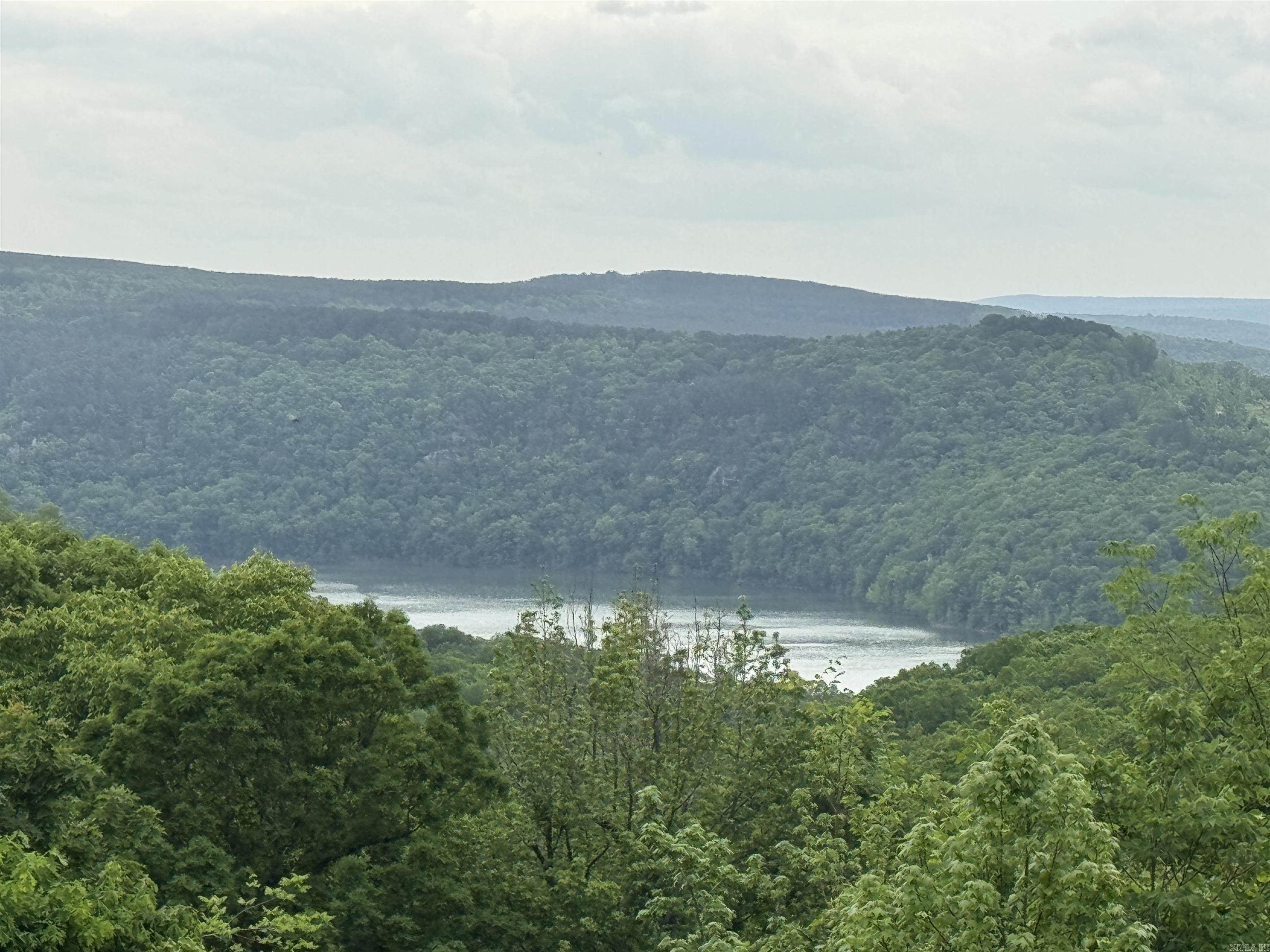 Great Lot in a desirable neighborhood for building a nice home! Super quiet area. Watersedge Drive is very close to the town of Greers Ferry and Fairfield Bay . Close to ATV, hiking, and mountain biking trails. Boat Ramp is at Devils fork park. Taxes to be determined at closing.