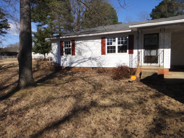 Older home with beautiful shaded lot. Wired 25x30 Shop with walk through and overhead door. 12x24 storage bldg. Storm shelter and large fenced back yard.  See Agent Remarks