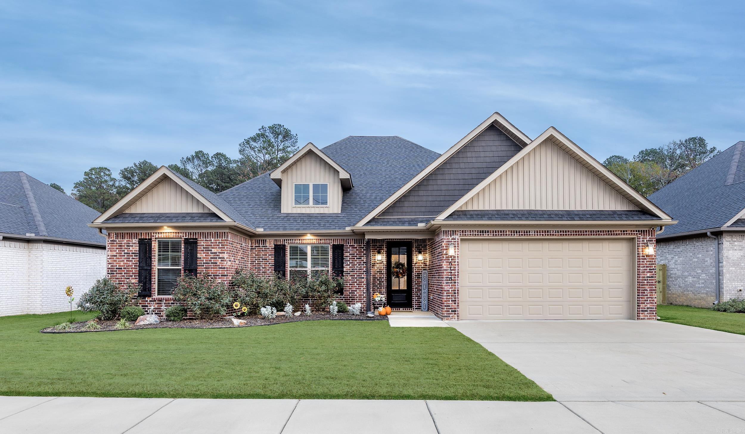 Beautifully upgraded 4BR/2BA all-brick home on a quiet cul-de-sac near shopping, dining, schools, and highway access. This move in ready home offers features including tall ceilings, shiplap accent walls, beamed ceilings, gas log fireplace, and an open living/kitchen/dining layout. Kitchen offers abundant cabinetry, natural stone countertops, large breakfast bar, gas cooktop, wall oven, microwave, and oversized walk-in pantry. Spacious primary suite features tray ceiling, custom window coverings, luxurious bath, walk-in shower, and massive closet with built-ins. Additional highlights include a 2-car garage, lockers, laundry room with sink. Enjoy the covered patio with tongue-and-groove ceiling overlooking the fully fenced backyard backing up to woods. A storage building (12x16 with loft) provides even more space for tools, hobbies, or outdoor equipment. This home combines upgraded finishes, energy-efficient all brick construction, privacy, and convenience in one exceptional property.  Rare opportunity in a desirable location.  Schedule your showing today!