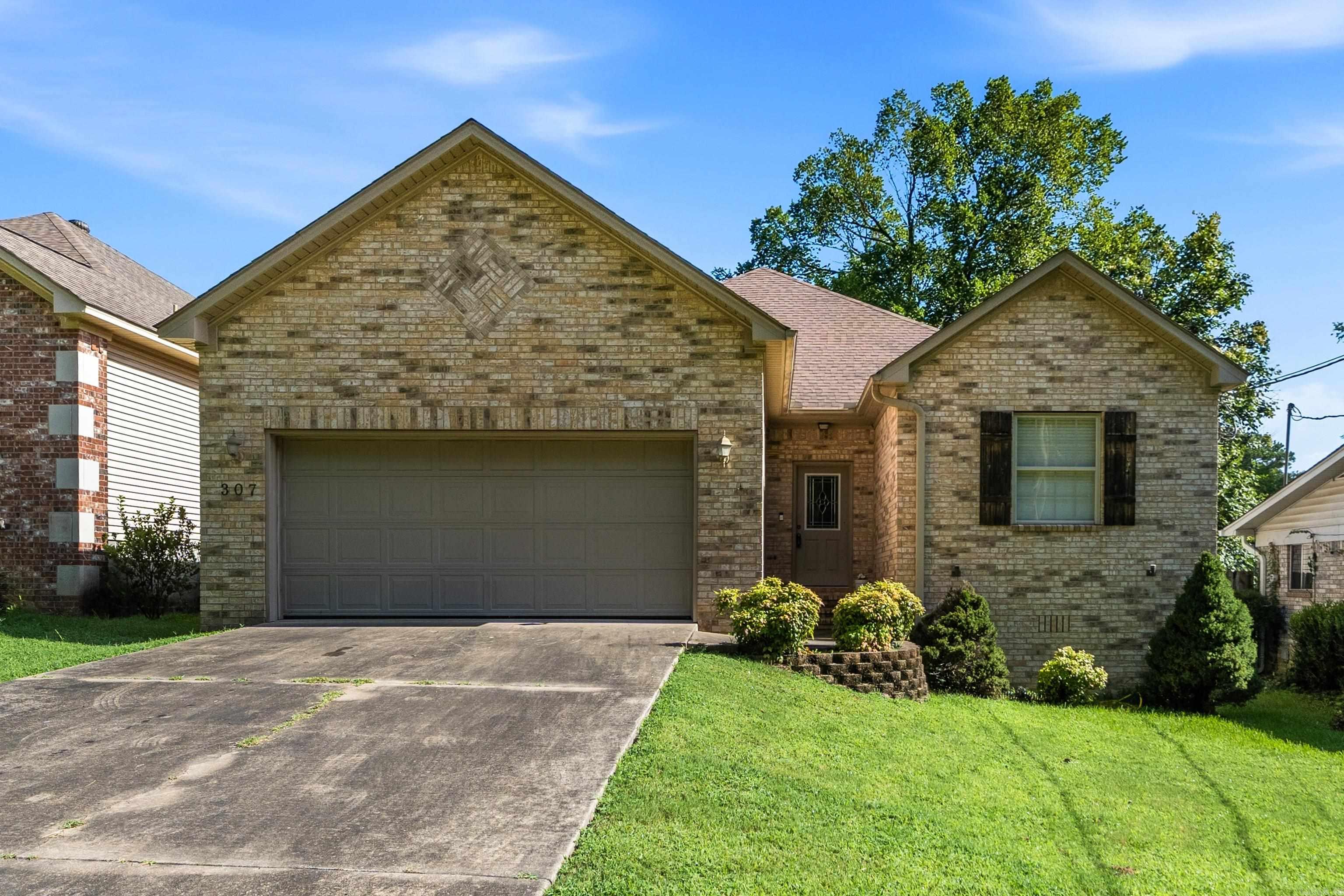 Welcome home to this beautifully maintained 3-bedroom, 2-bath home in Lakeside School District. Built in 2005, this 1,517-square-foot home offers an inviting open floor plan with vaulted ceilings, beautiful wood flooring throughout main living areas, and spacious living and dining areas designed for comfortable everyday living.  The kitchen overlooks the main living space and features a breakfast bar, generous cabinet storage, and an adjoining dining area, making it easy to stay connected while entertaining family and friends. The private primary suite offers a comfortable retreat, while two additional bedrooms provide flexibility for family, guests, or a home office.  Step outside to enjoy the fully fenced backyard, a peaceful setting for the above-ground pool—perfect for cooling off during Arkansas summers, hosting backyard gatherings, or simply unwinding at the end of the day.  Complete with a 2-car garage and conveniently located just minutes from the country club, shopping, dining, medical facilities, and everyday conveniences, this move-in-ready home offers the perfect combination of comfort, functionality, and location.