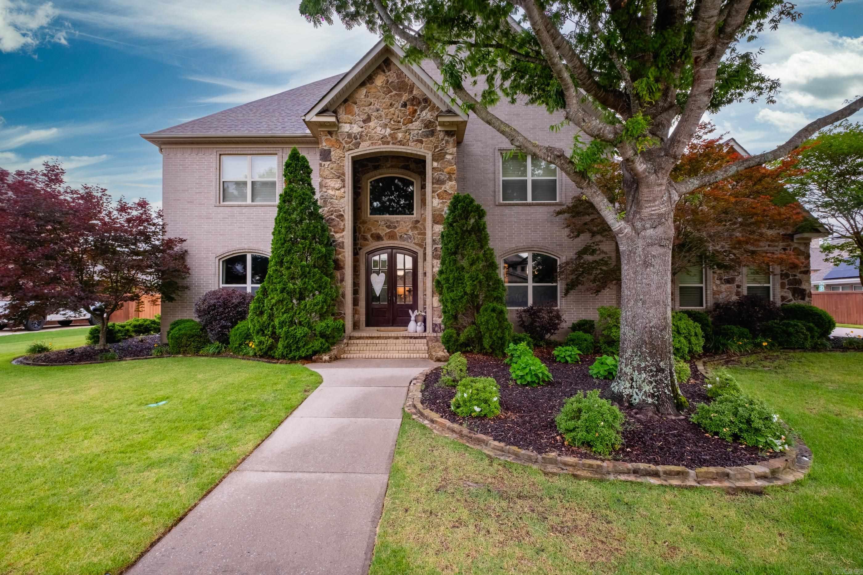 Stunning custom built home offering 5 spacious bedrooms, 4 full baths, and 2 half baths with an exceptional layout designed for both everyday living and entertaining. The luxurious primary suite is conveniently located on the main level along with a formal dining room, office or 2nd living down, large main living room, expansive kitchen, breakfast area, and an oversized laundry room.  Upstairs features 4 additional bedrooms plus two generous living/flex spaces — with the option for one to serve as a 6th bedroom if desired. Additional Laundry upstairs as well.    Step outside to a beautifully landscaped, flat backyard retreat complete with a covered patio, resort-style pool, and a private sport court perfect for basketball or pickleball. A side-loading 3-car garage adds both convenience and curb appeal to this incredible property.  As part of the POA, residents enjoy access to a private park located by the pond, along with gated card-access for launching a boat into the pond/Little Maumelle River for fishing and recreation. Enjoy kayaking and canoeing right from the river located behind the home, creating the perfect blend of luxury living and outdoor adventure.