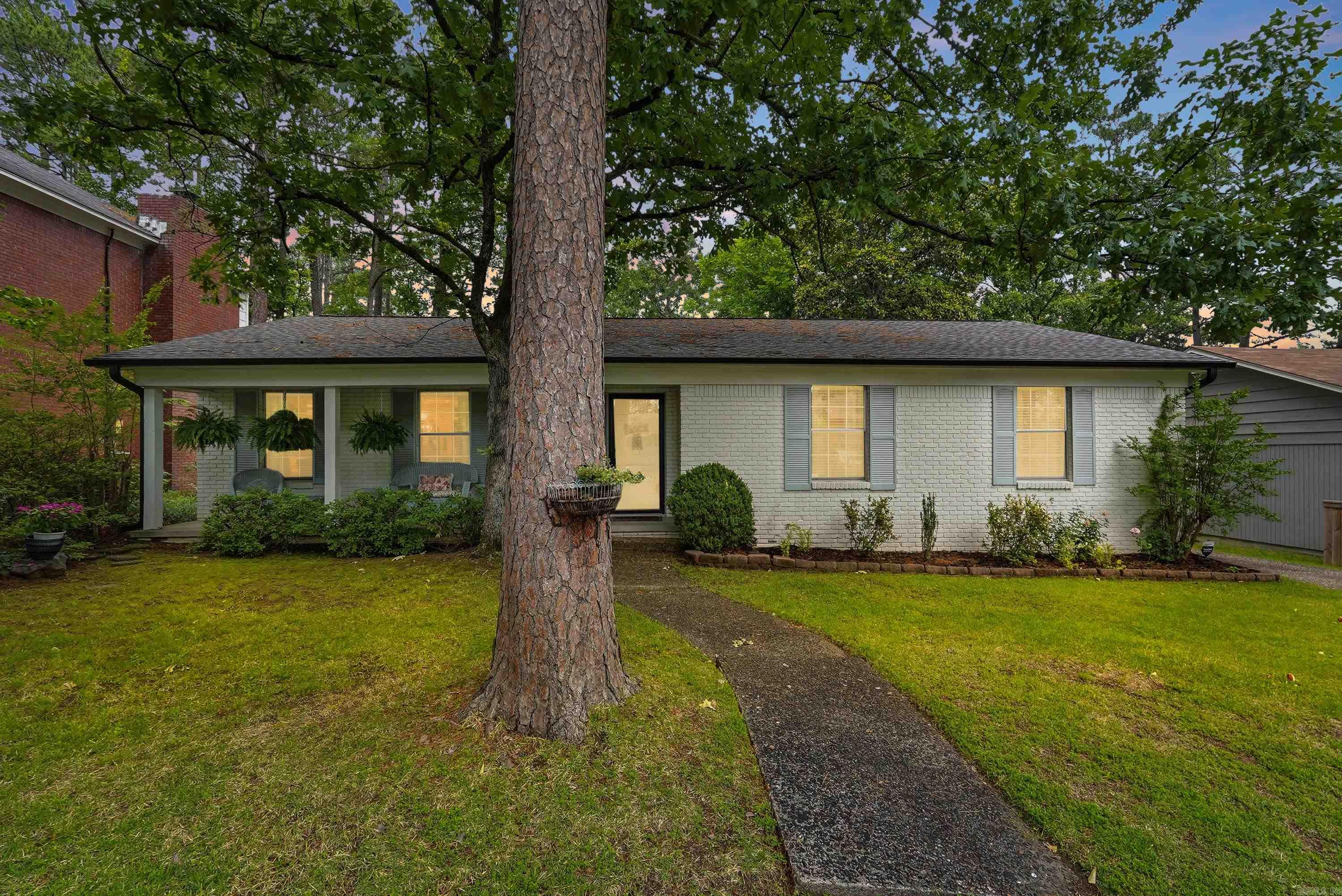 Move-in ready, and we mean it. This 1956 sq ft brick ranch sits on a level lot on a quiet dead-end street, so the only traffic out front is the kind you wave at. Three bedrooms, two full baths, and two living areas that both open to the kitchen, the way a house should flow when company shows up. The big stuff is already handled: new roof and gutters in 2024, new hot water tank and garbage disposal the same year, and an A/C that gets serviced like clockwork. Both bathrooms updated in the last five years. Kitchen wears fresh countertops, new backsplash, and new flooring that carries into the den. The 225 sq ft deck is made for slow evenings, and the garage door is only five years old. Out back, the detached garage comes with a built-in workbench for the tinkerer in the family. Washer, dryer, and garage fridge stay. Bring your boxes, hang your pictures, pour yourself something cold. Schedule your showing today and make it yours!