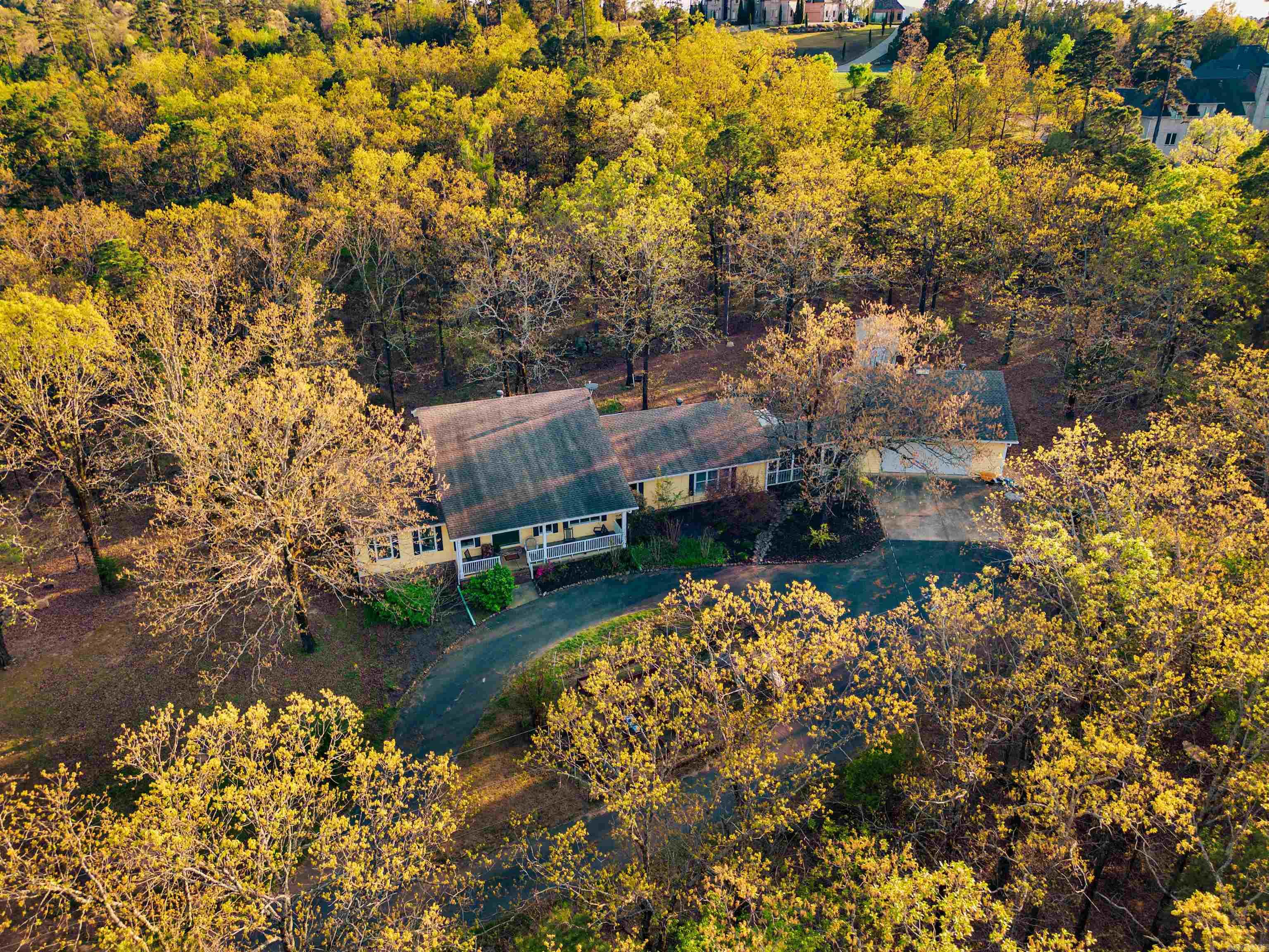 Discover a true hidden gem just 10 minutes from West Little Rock! This family oriented property offers the perfect blend of character, space, and privacy on a 4.11 acres. Featuring a main-level master and en suite separate from other bedrooms, a chef’s kitchen, hidden spacious pantry cabinets, custom made island, separate dining area, and a wonderfully oversized family room, this home is designed for comfortable living! Updates abound, including new gutters with guards, French drains, screened-in large breeze way for entertaining, a stylish herringbone patio, and a back yard Trex deck (off kitchen). The property boasts a massive detached double deep, 2 car garage with insulated overheard garage door for winter projects, versatile attic space (perfect for an office or guest quarters), additional outdoor sitting areas, 8 person storm shelter and raised garden beds. So many more details when you see in person! Transferable septic and crawlspace serivce policies included. A rare find—this well maintained property could be your next home!