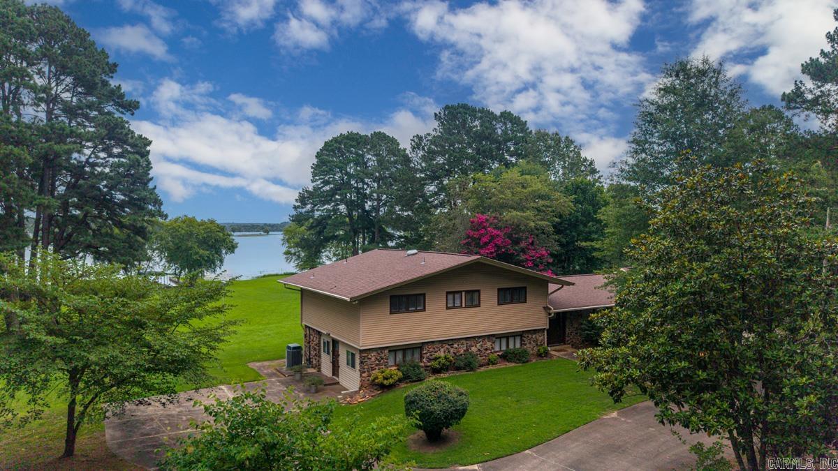 Not to be harsh, but approval letter for financing before showing appointments please! Why travel hours to get to the lake when you can own a home on a less populated lake in Central Arkansas. Within 5 to 8 minutes of all the anemones (food, shopping, entertainment); properties on Beaver Fork Lake are hard to come by. 1.9 acres of Lakefront property is screaming… “come home”, or Airbnb! Property comes with its own private boat dock offering two slips. Built in 1966, the home has been totally updated entirely, including its own entrance to an office that could be used for business or a 5th bedroom with its own bathroom, separated from the rest of the household via locking door. This Tri-Level entertains 4 bedrooms (same level), 2 full baths – 4 bathrooms in total. Entrance through the front door, enters you into the living area, which includes the living room, dining room, and kitchen area. Home includes a man cave, or game room. On the opposite side includes a den with fireplace insert and entertainment area. Level lot, heating and A/C, hot water tanks, roofing, has all been updated within the last few years. A shop that is A/C cooled and a two-car carport area for storage.